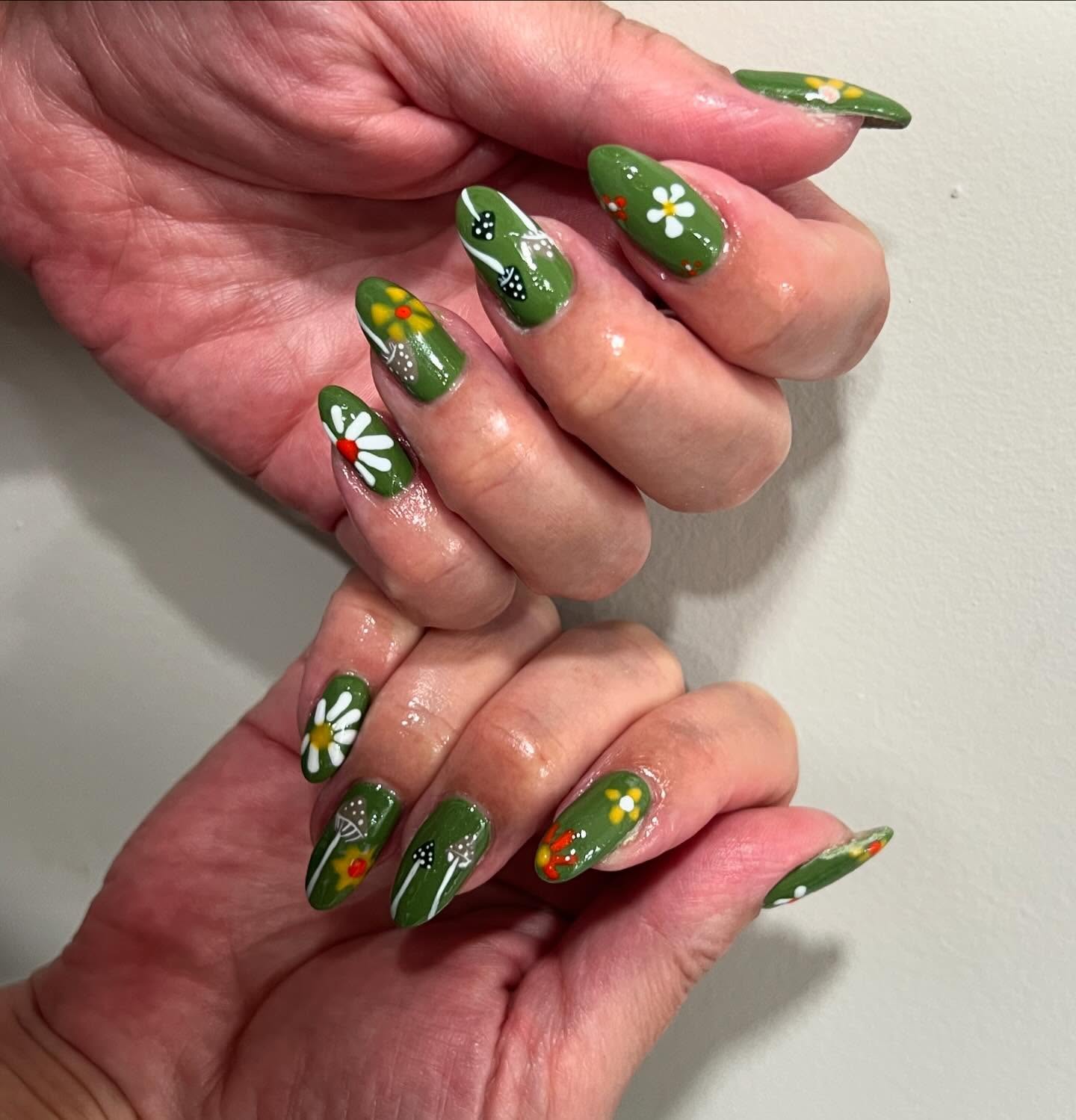 Whimsical Garden Green Almond Nails with Daisy Art