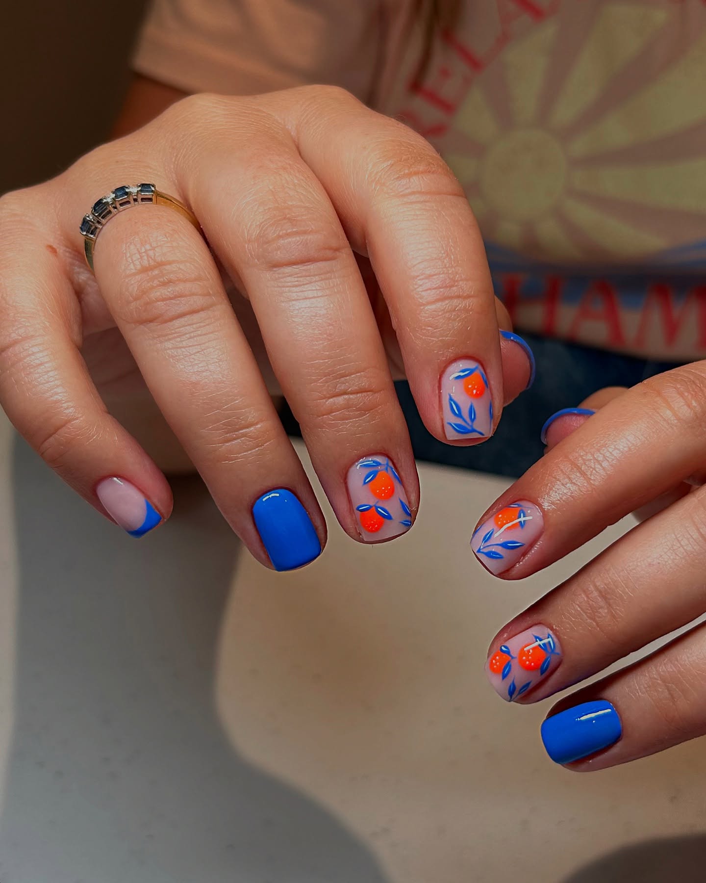 Abstract Fruit & Blue French Short Nails