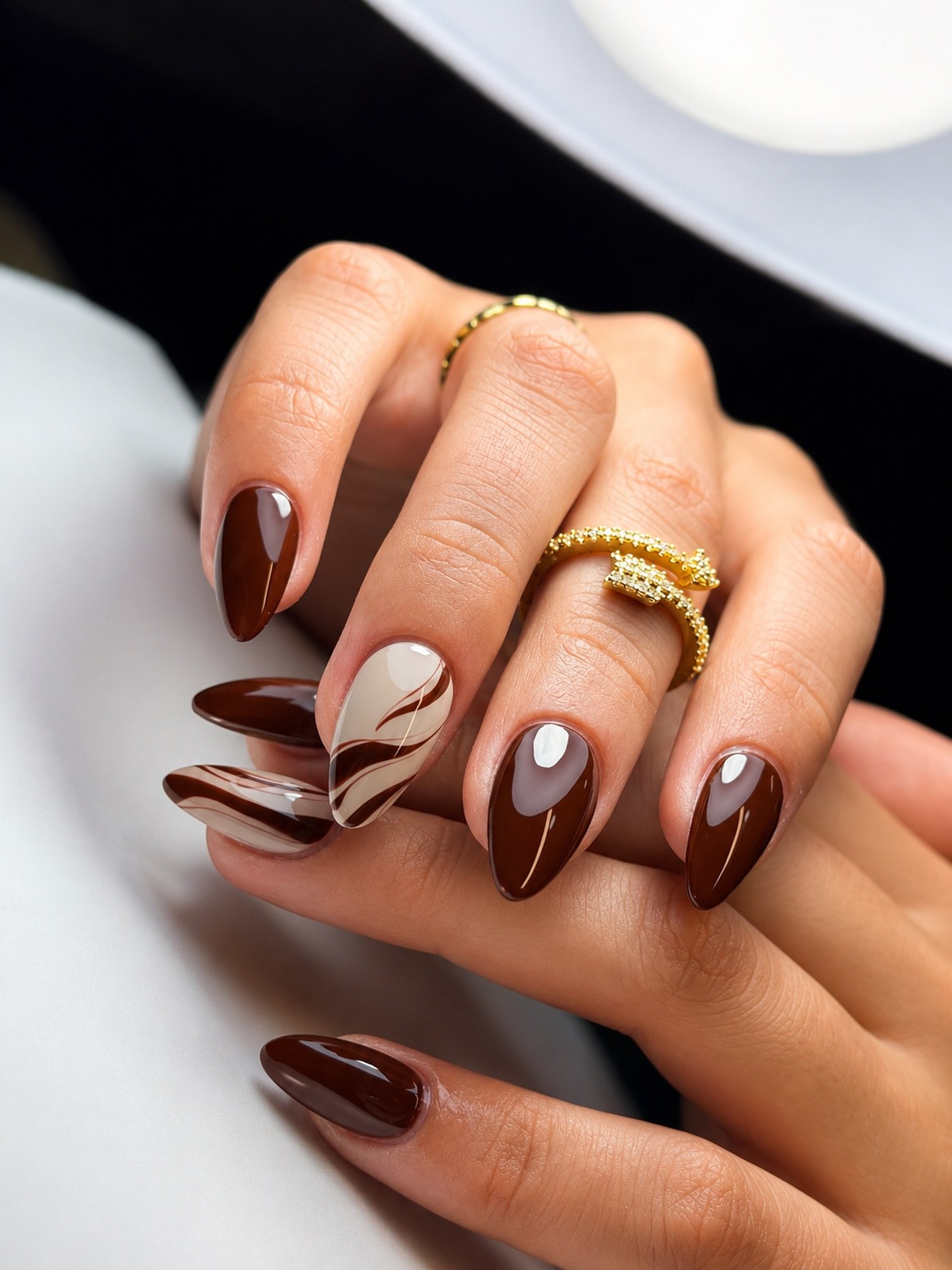 Glossy Chocolate Swirl Almond Nails