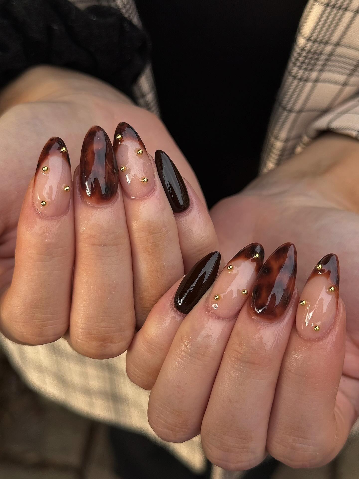 Glossy Tortoiseshell Almond Nails with Gold Studs