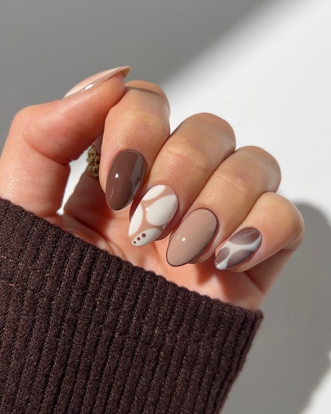 Abstract Swirl Nude and Brown Oval Nails