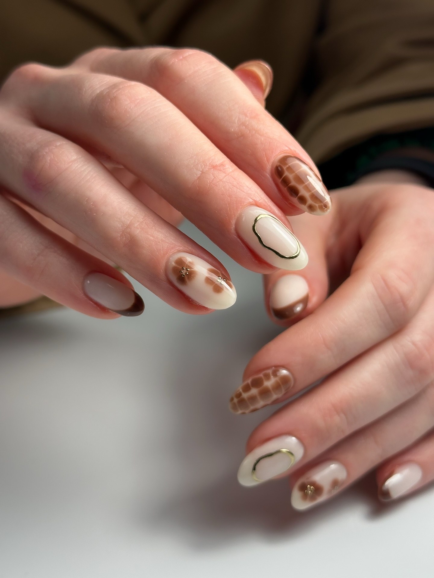 Neutral French Tips with Chic Animal Print Accents