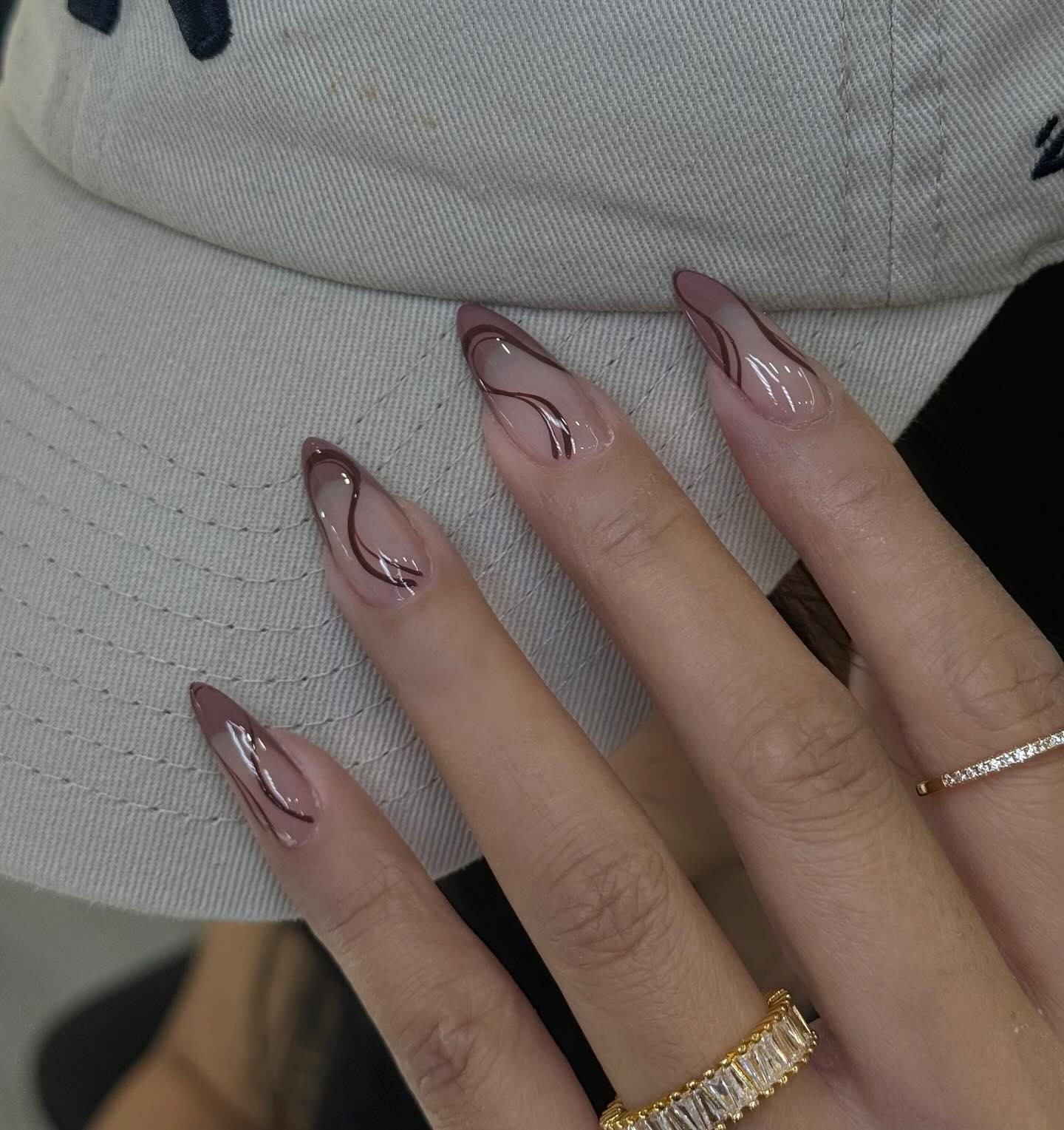 Sheer Nude Swirl Almond Nails