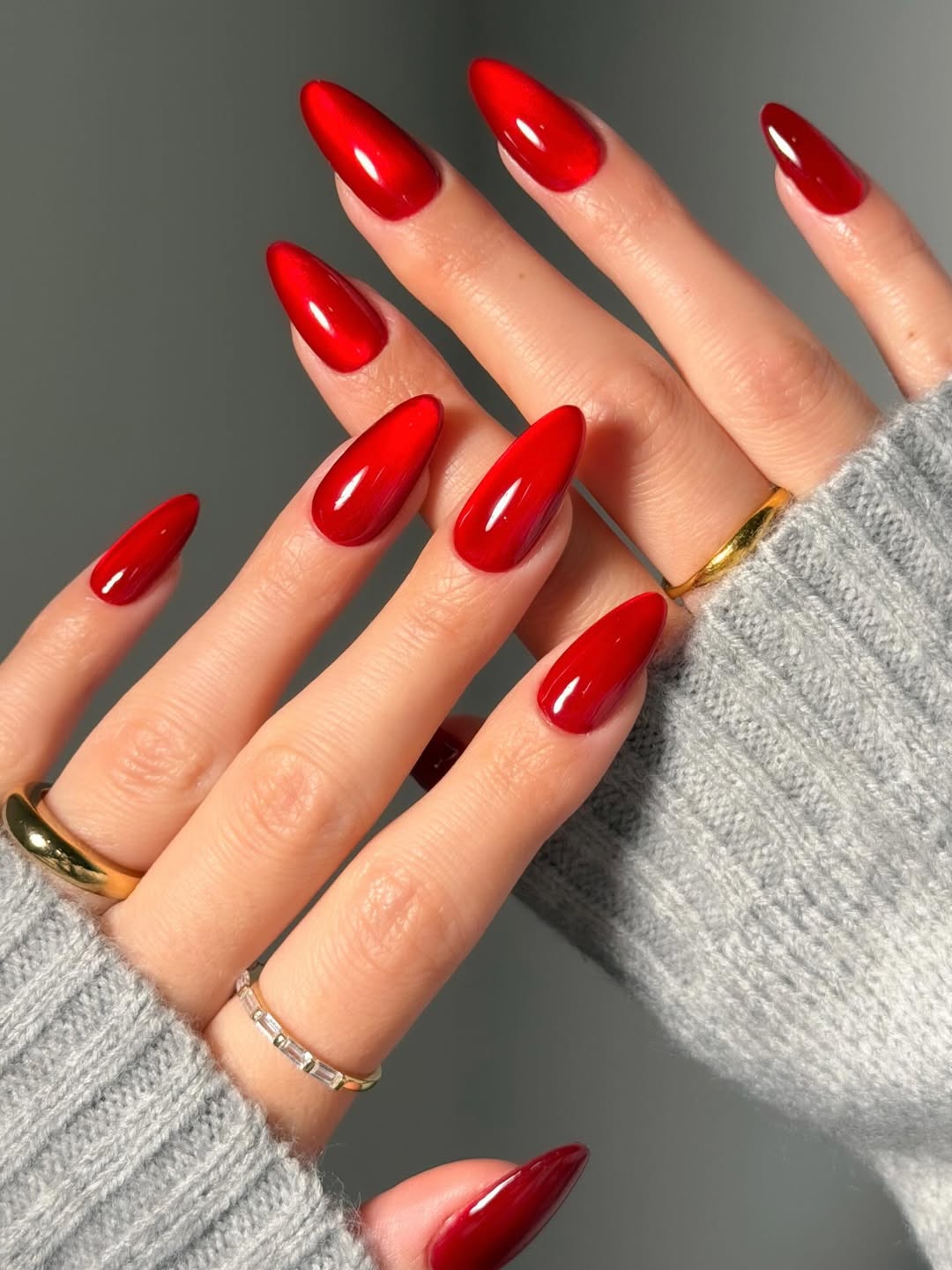 Vibrant Crimson Cat Eye Almond Nails