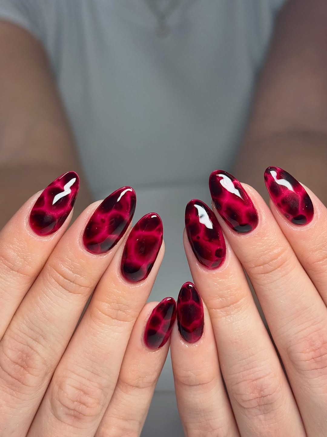 Vibrant Deep Red Tortoiseshell Almond Nails
