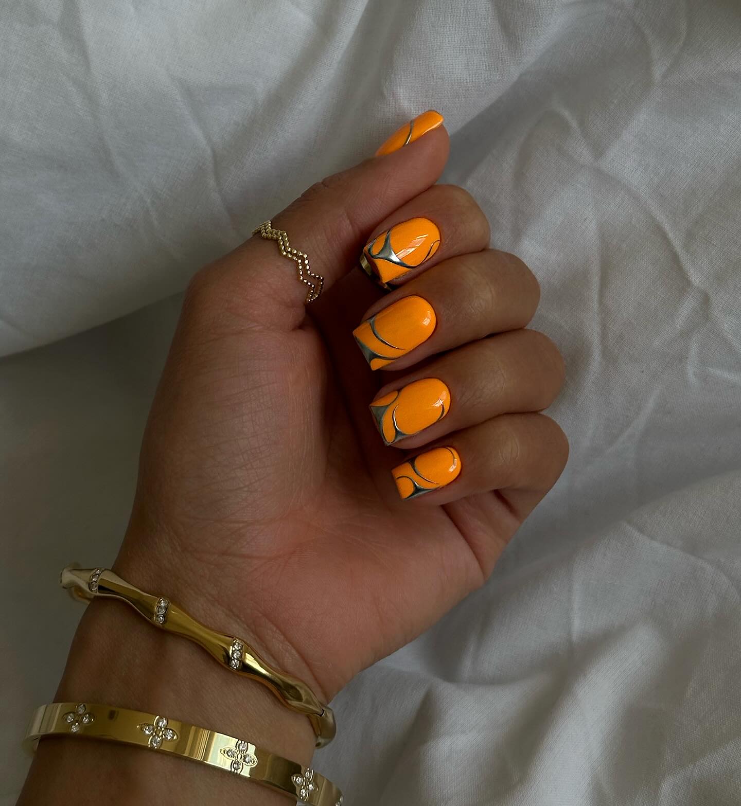 Vibrant Orange Swirl French Tip Nails