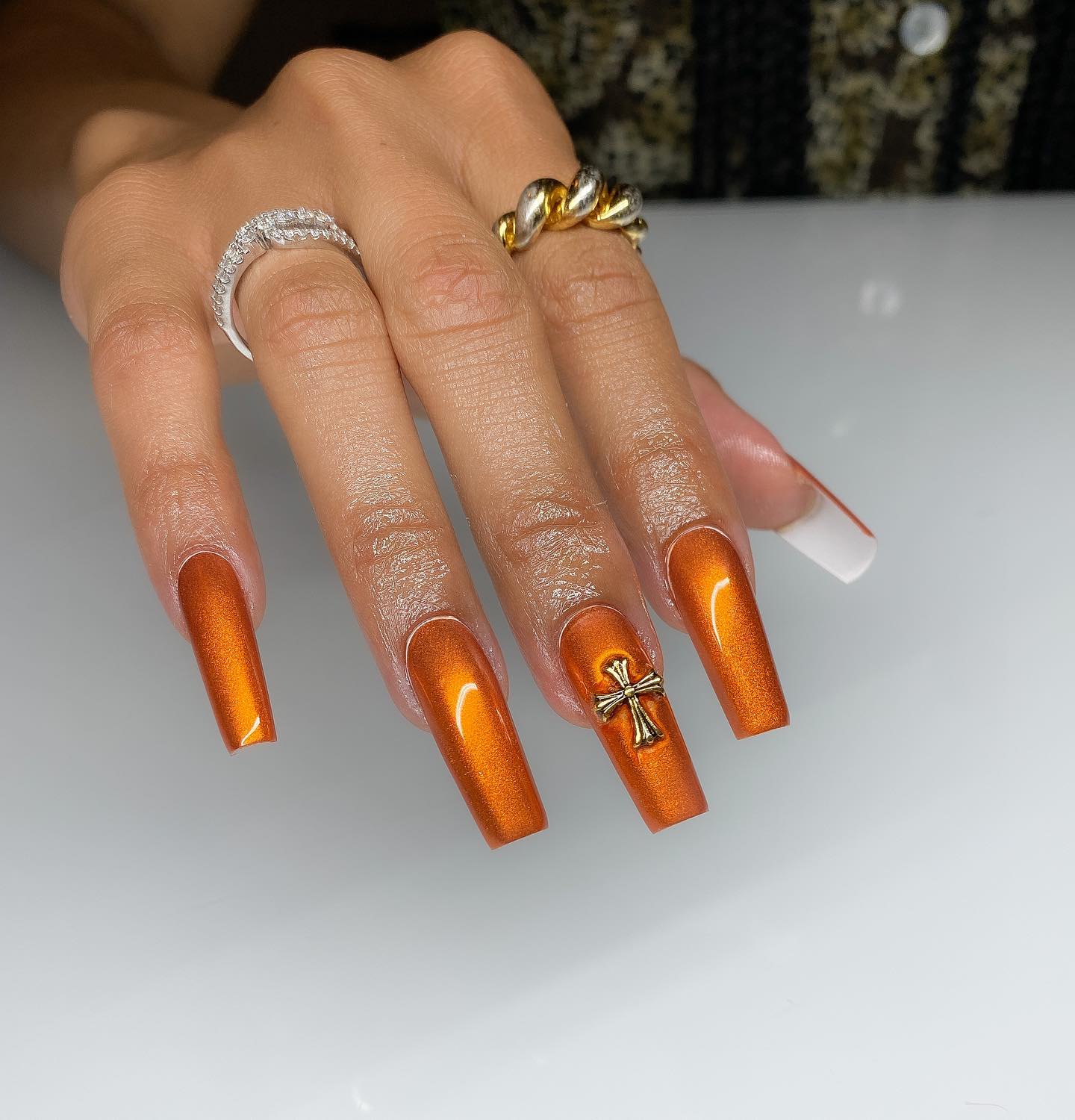 Orange Chrome Coffin Nails with Gold Cross Charm