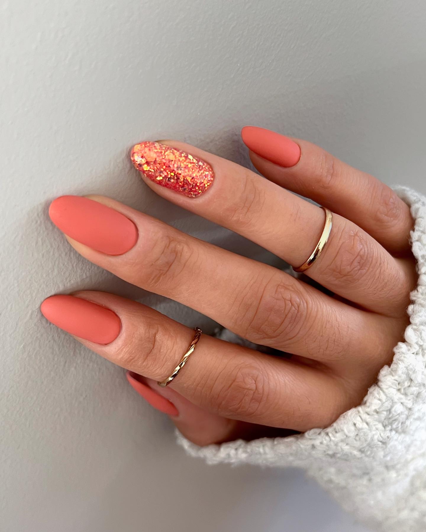 Matte Coral Glitter Accent Almond Nails
