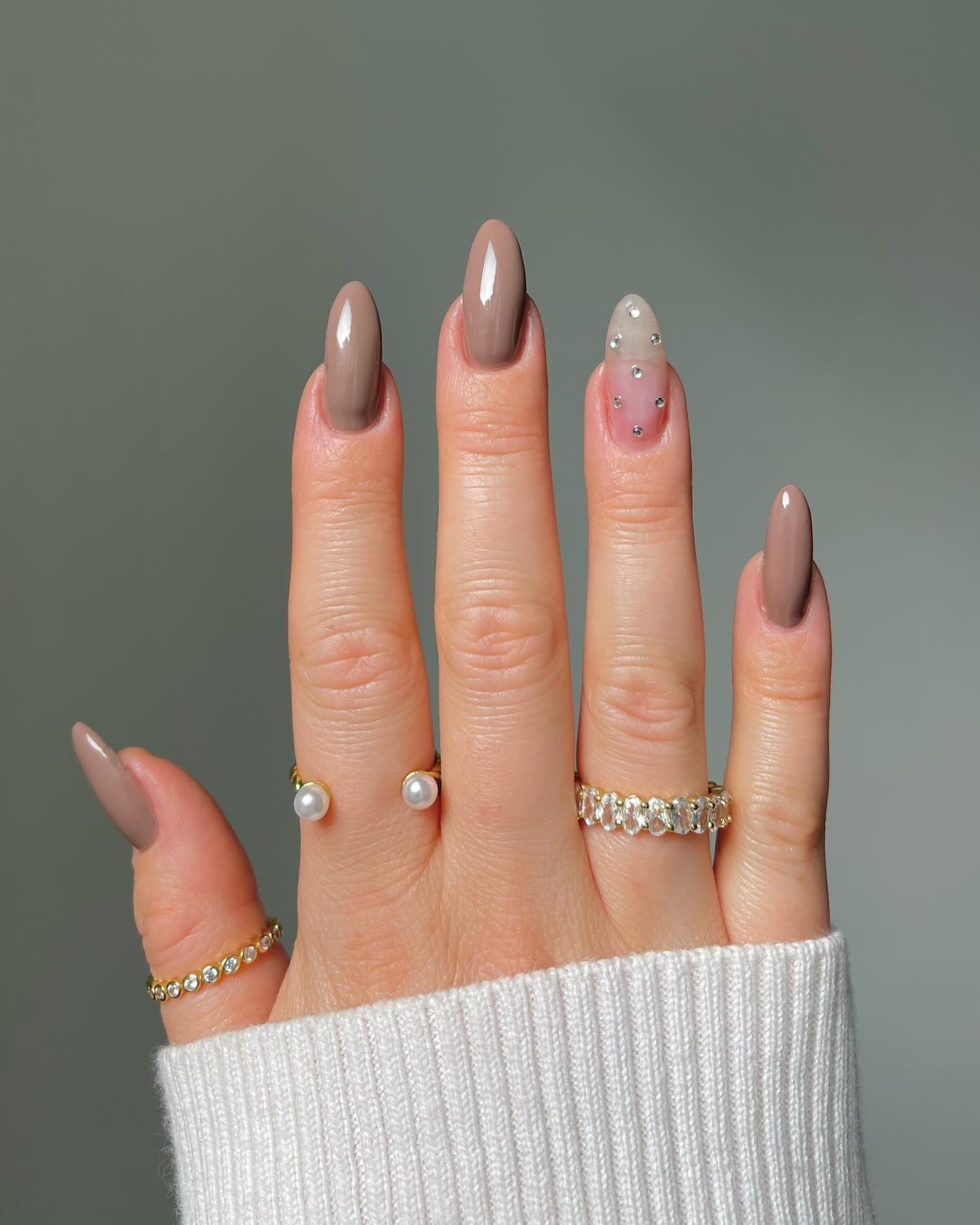 Elegant Taupe Almond Nails with Rhinestone Accents