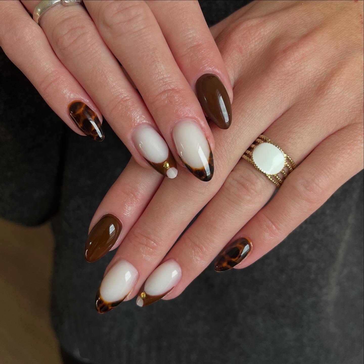 Glossy Tortoiseshell French Tip Almond Nails