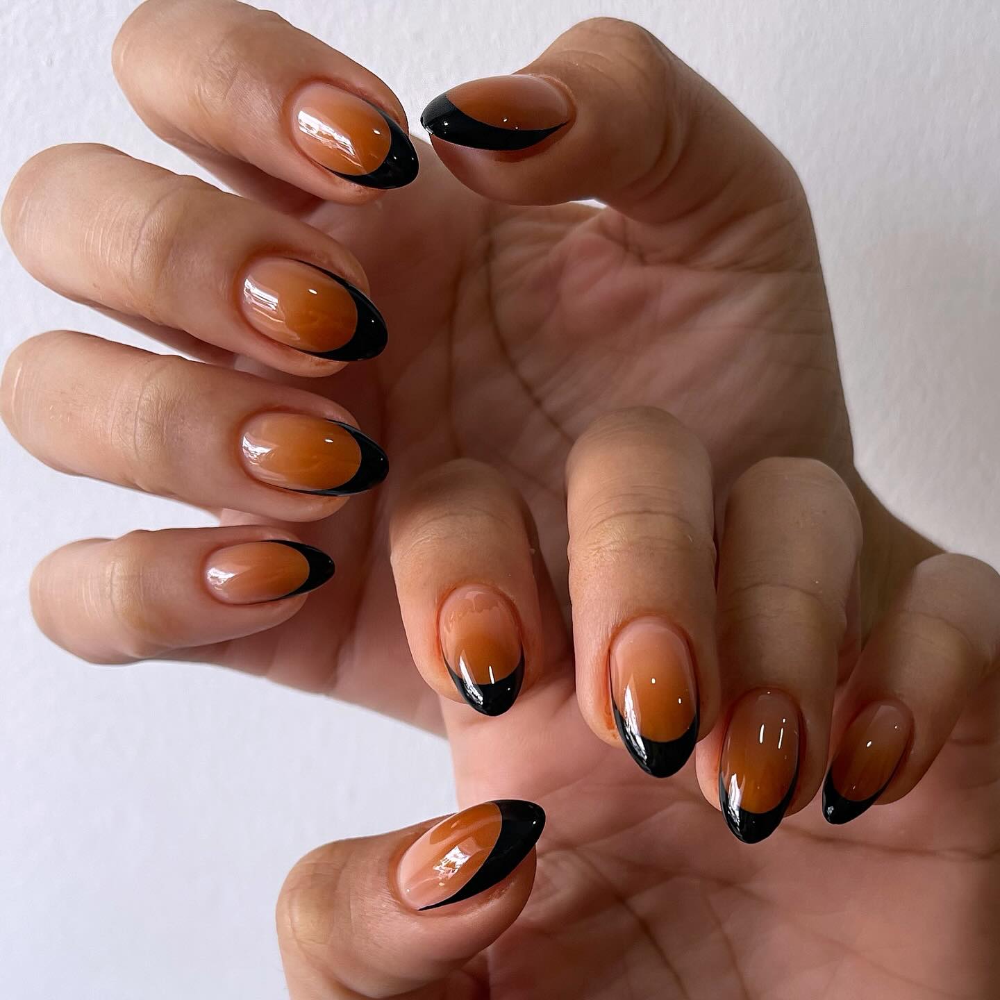 Deep Amber and Black French Ombre Almond Nails