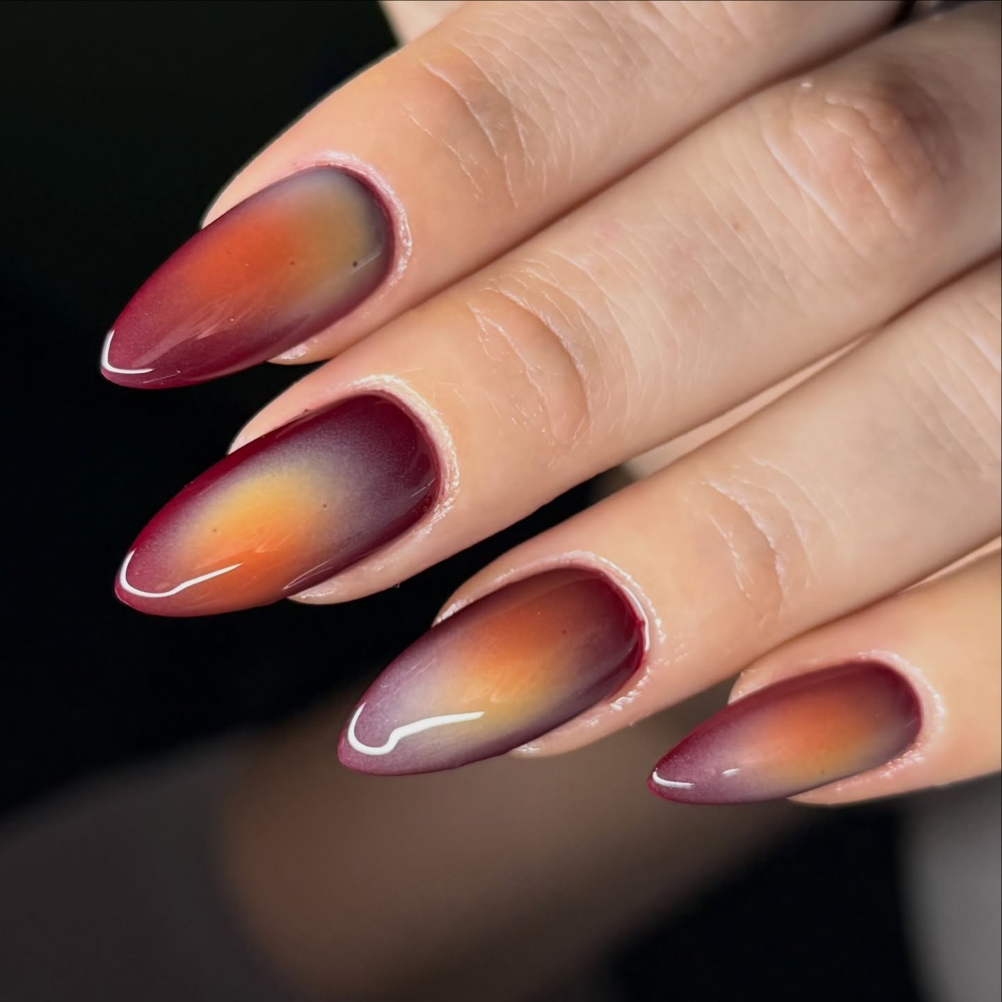 Warm Autumn Ombre Almond Nails with White Swirl Accent
