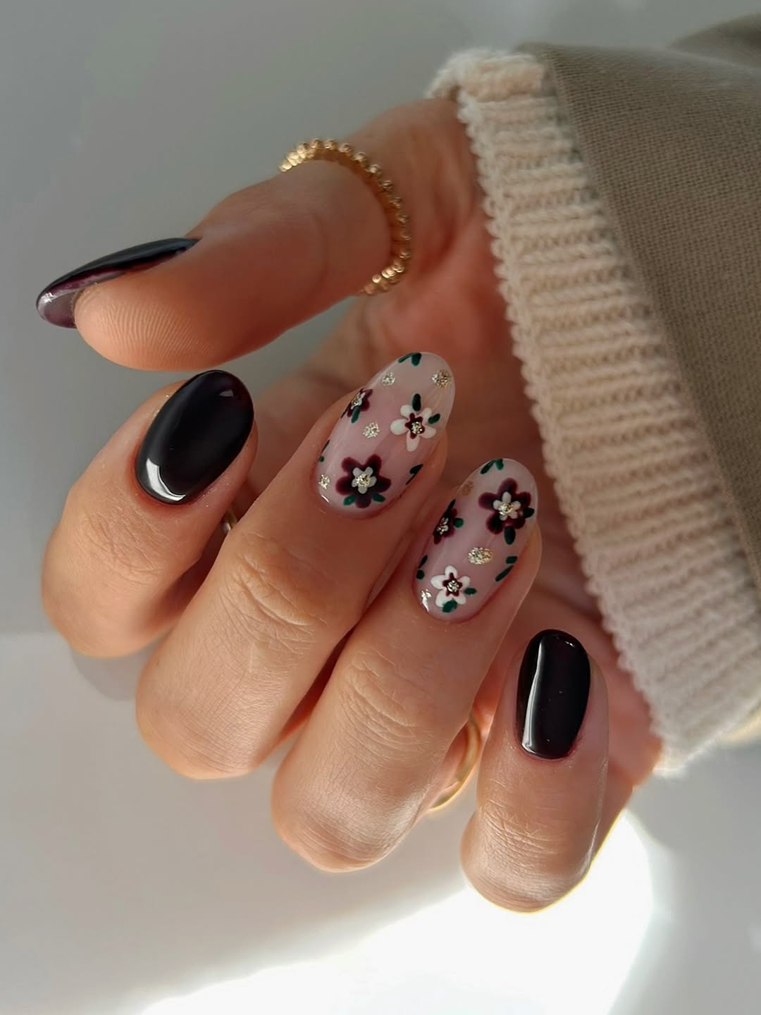 Dark Floral Oval Nails with Gold Accents