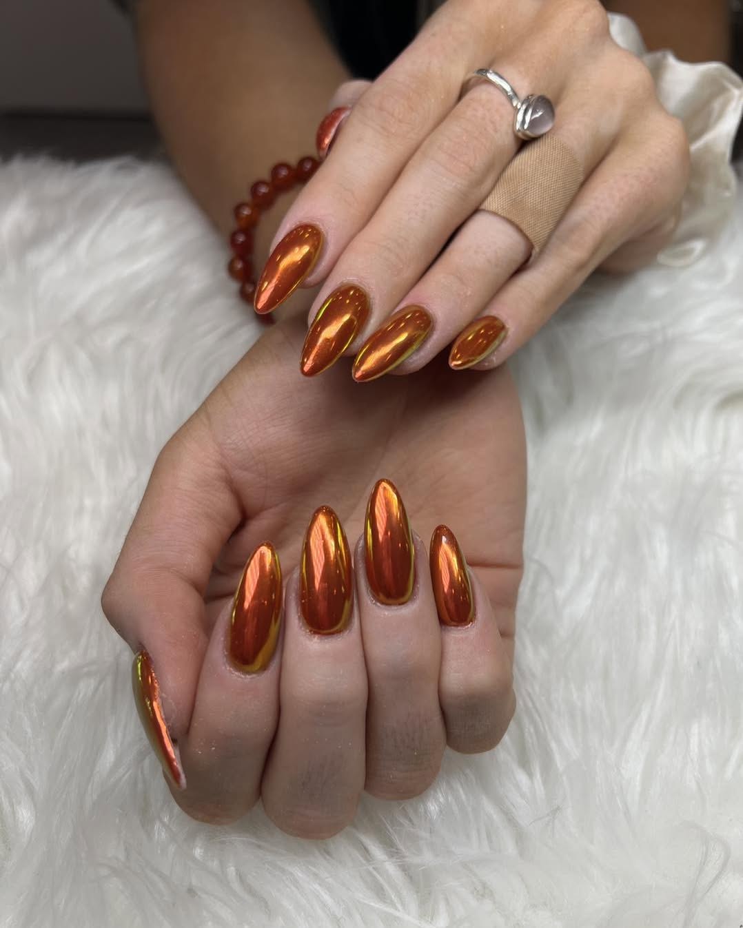 Fiery Orange Chrome Stiletto Nails