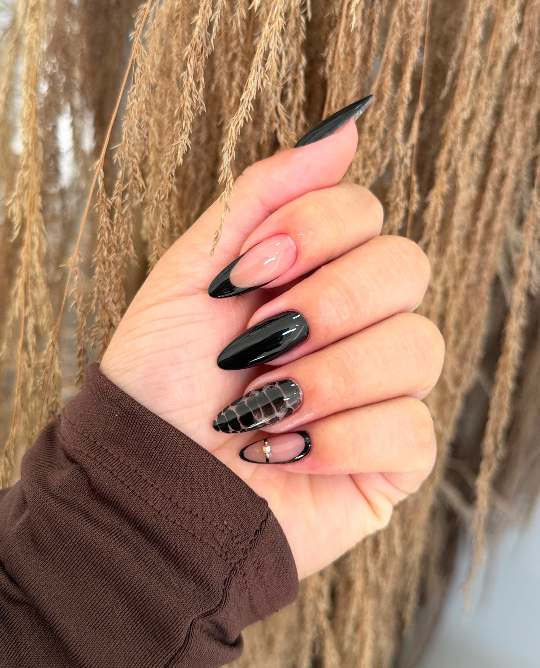 Glossy Black Almond French Tip Nails with Snake Accent