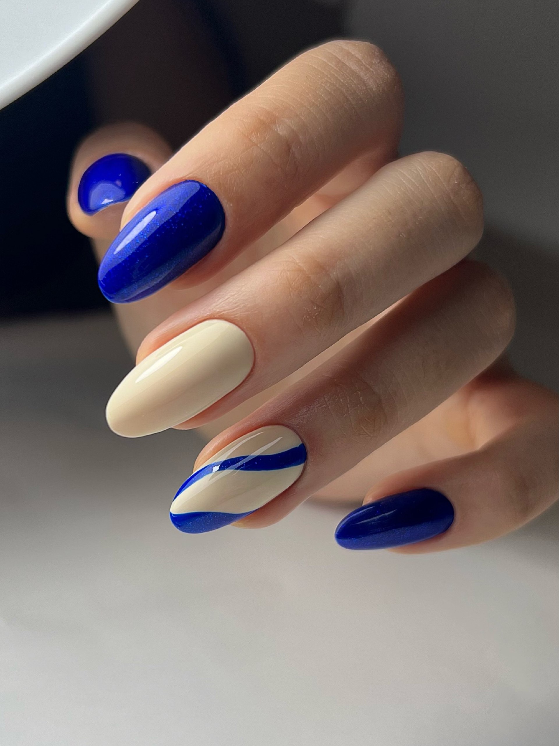 Vivid Blue and Cream Swirl Almond Nails