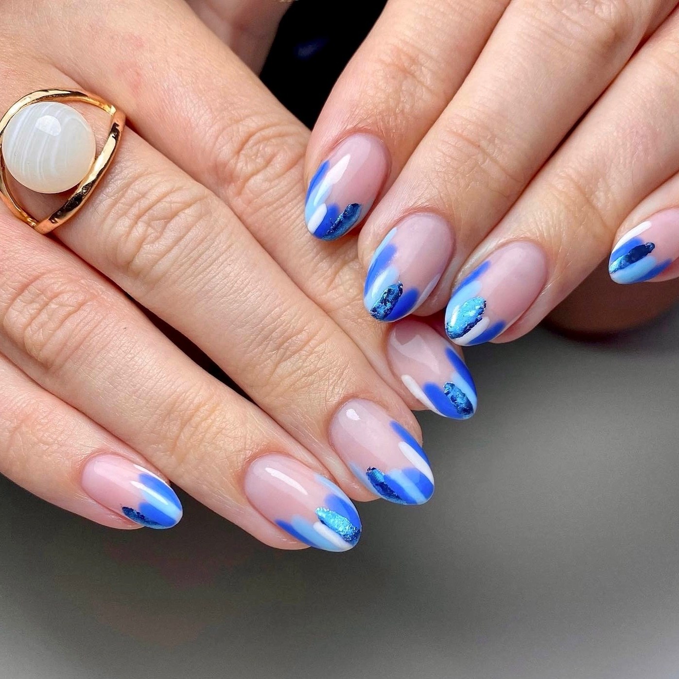 Abstract Blue Swirl French Tip Almond Nails