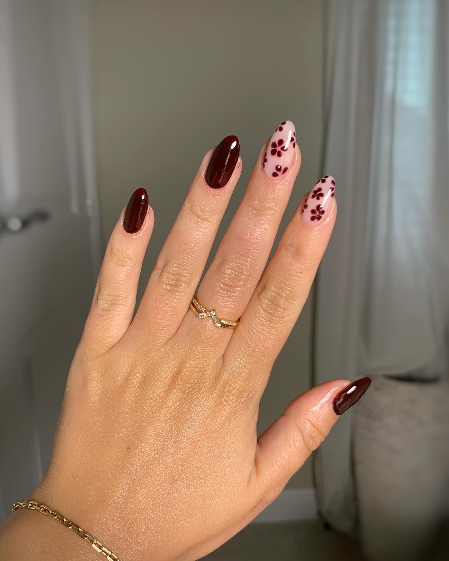 Deep Burgundy Almond Nails With Floral Accents