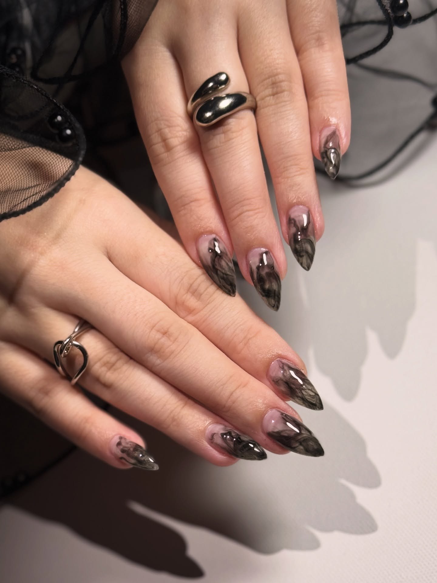 Smoky Black Swirl Almond Nails