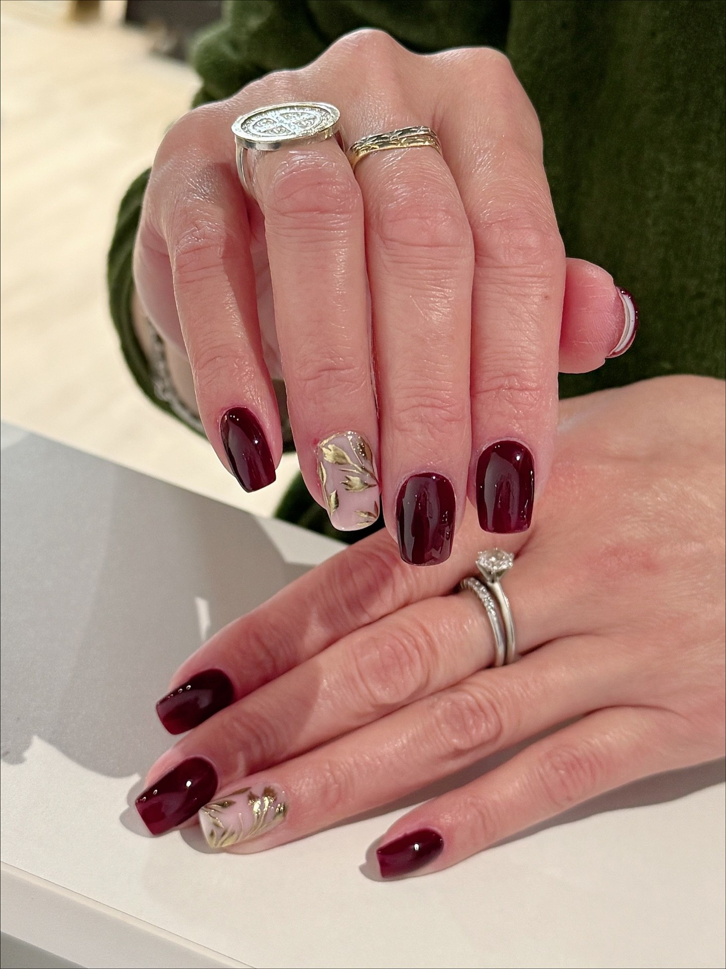 Deep Burgundy Glossy Nails With Gold Accent