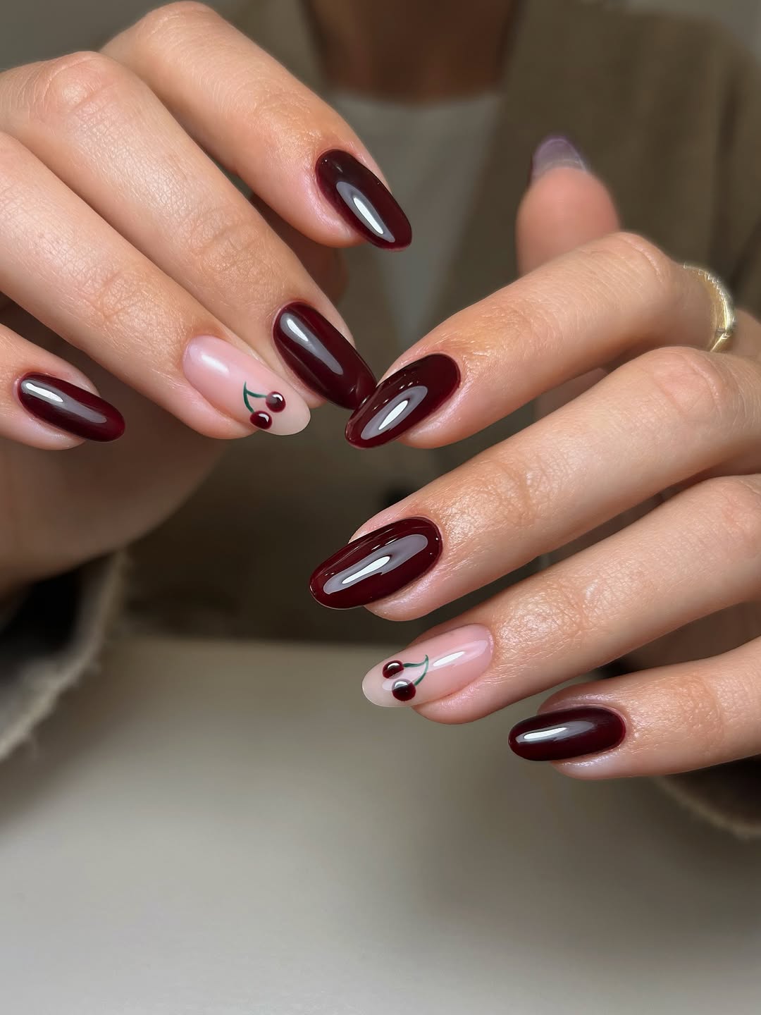 Glossy Deep Cherry Oval Nails With Cherry Art