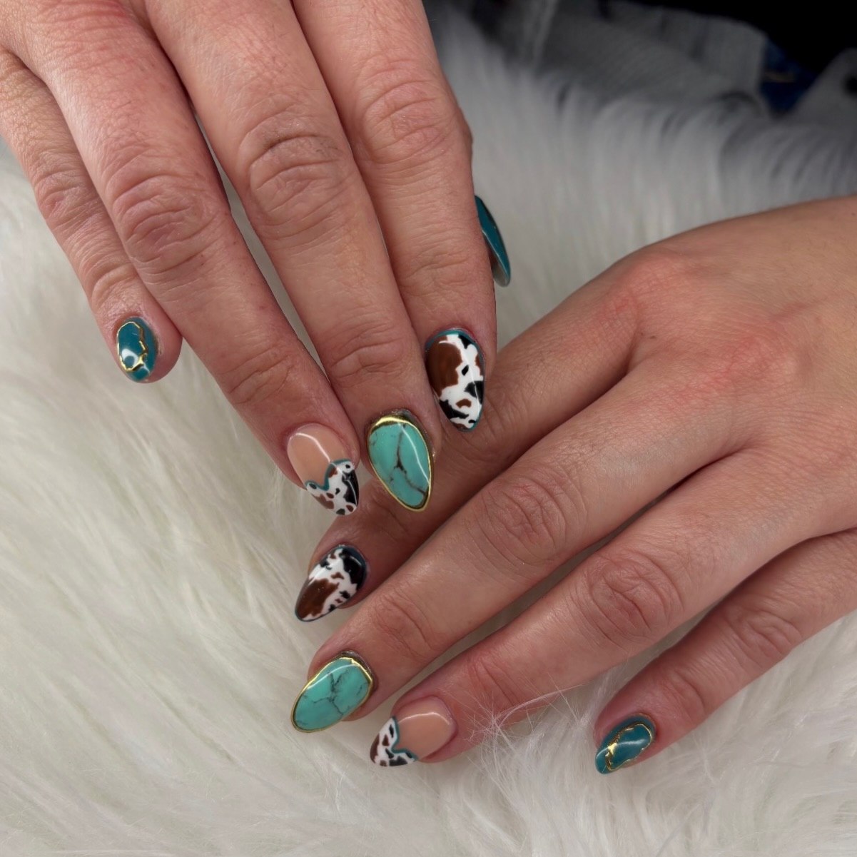 Cow Print Turquoise Almond Nails with Gold Accents