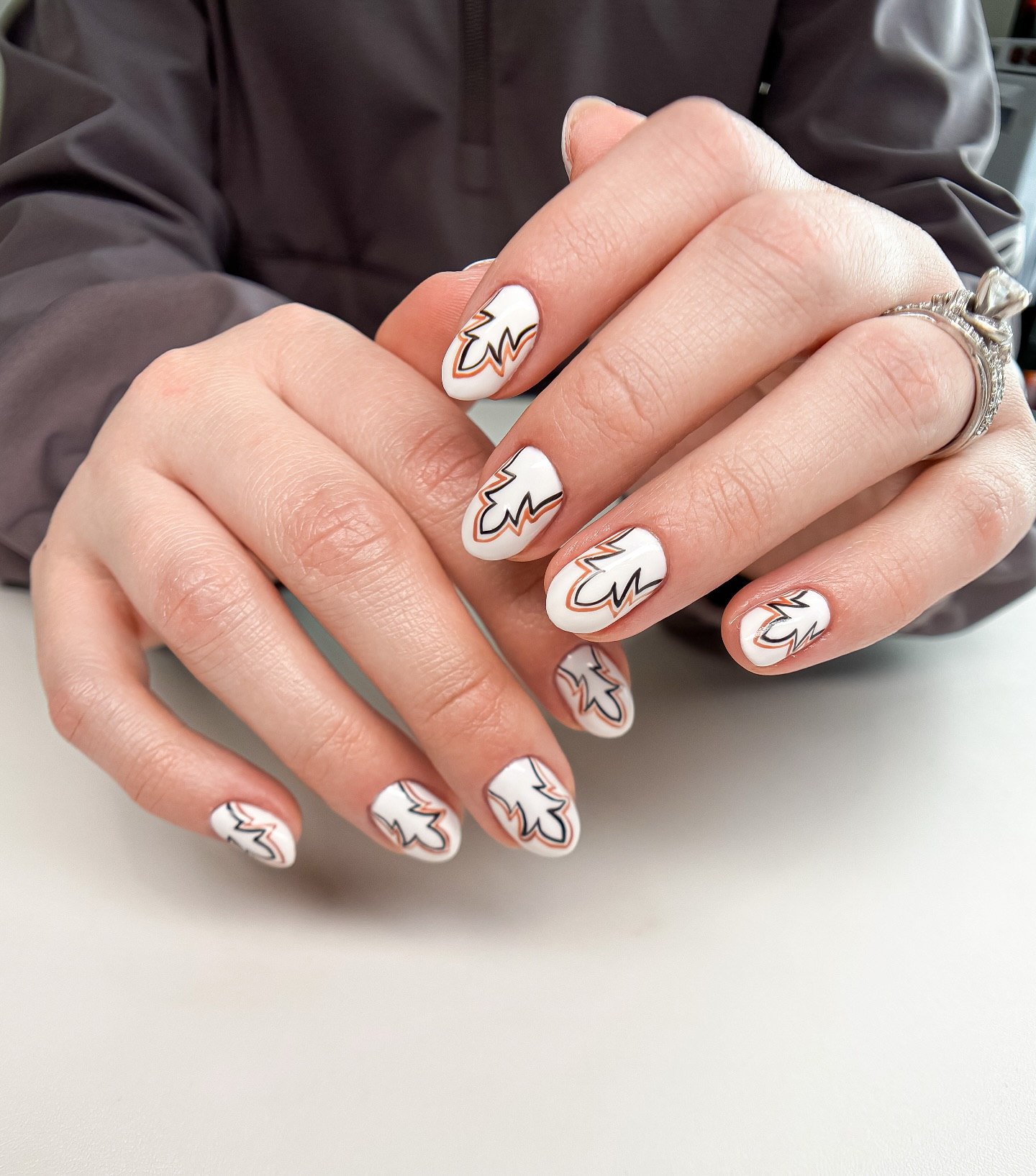 White Oval Nails With Flame Outline Art