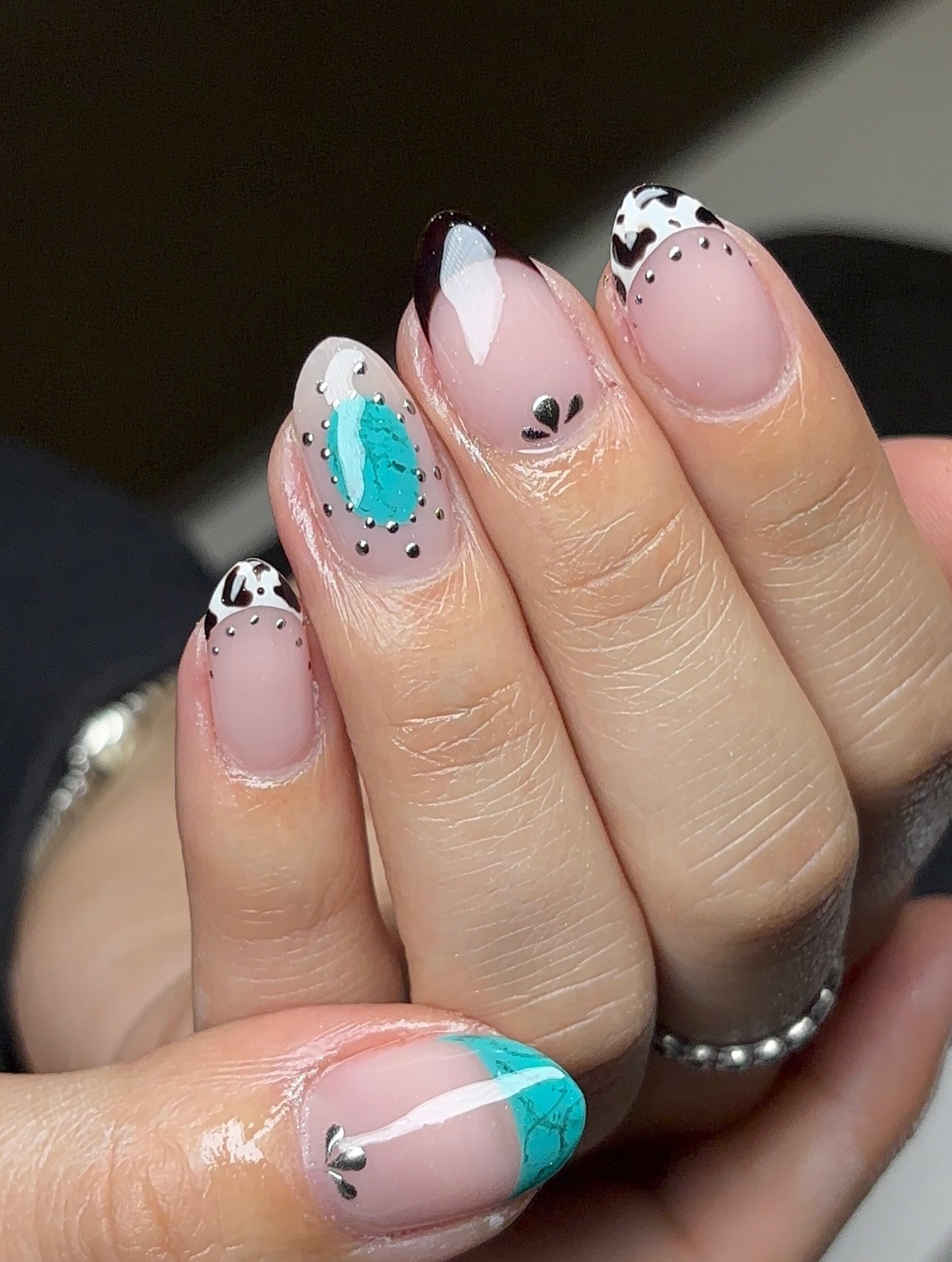 Cow Print & Turquoise French Tip Almond Nails