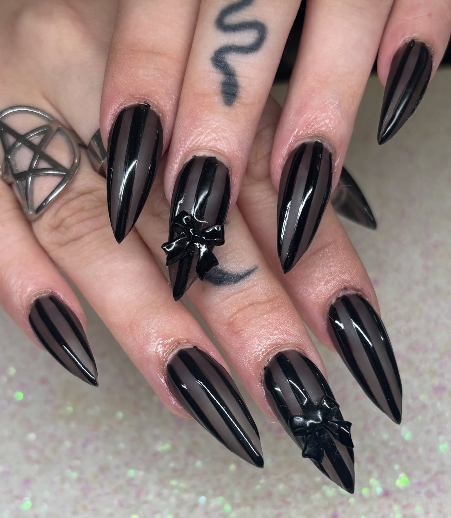Glossy Black Striped Stiletto Nails with Bows