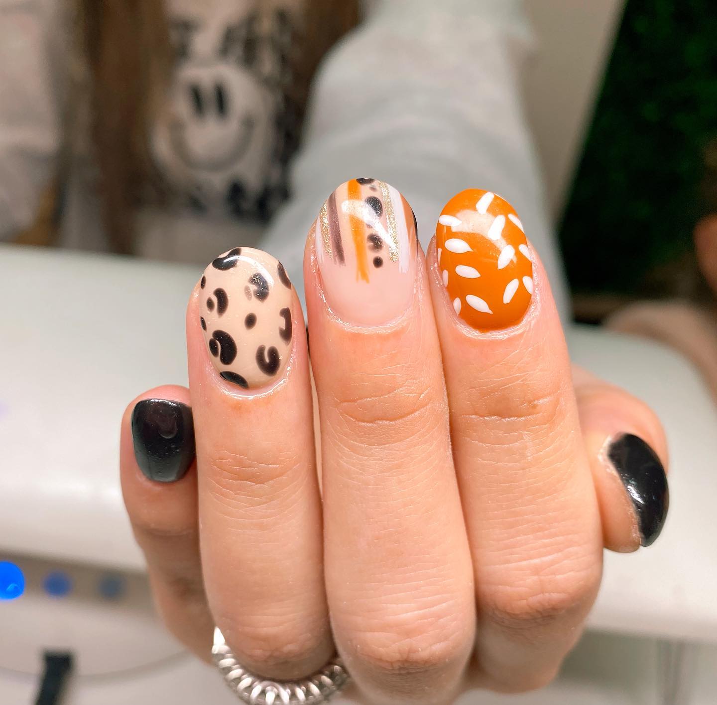 Playful Cheetah and Orange Fall French Tips