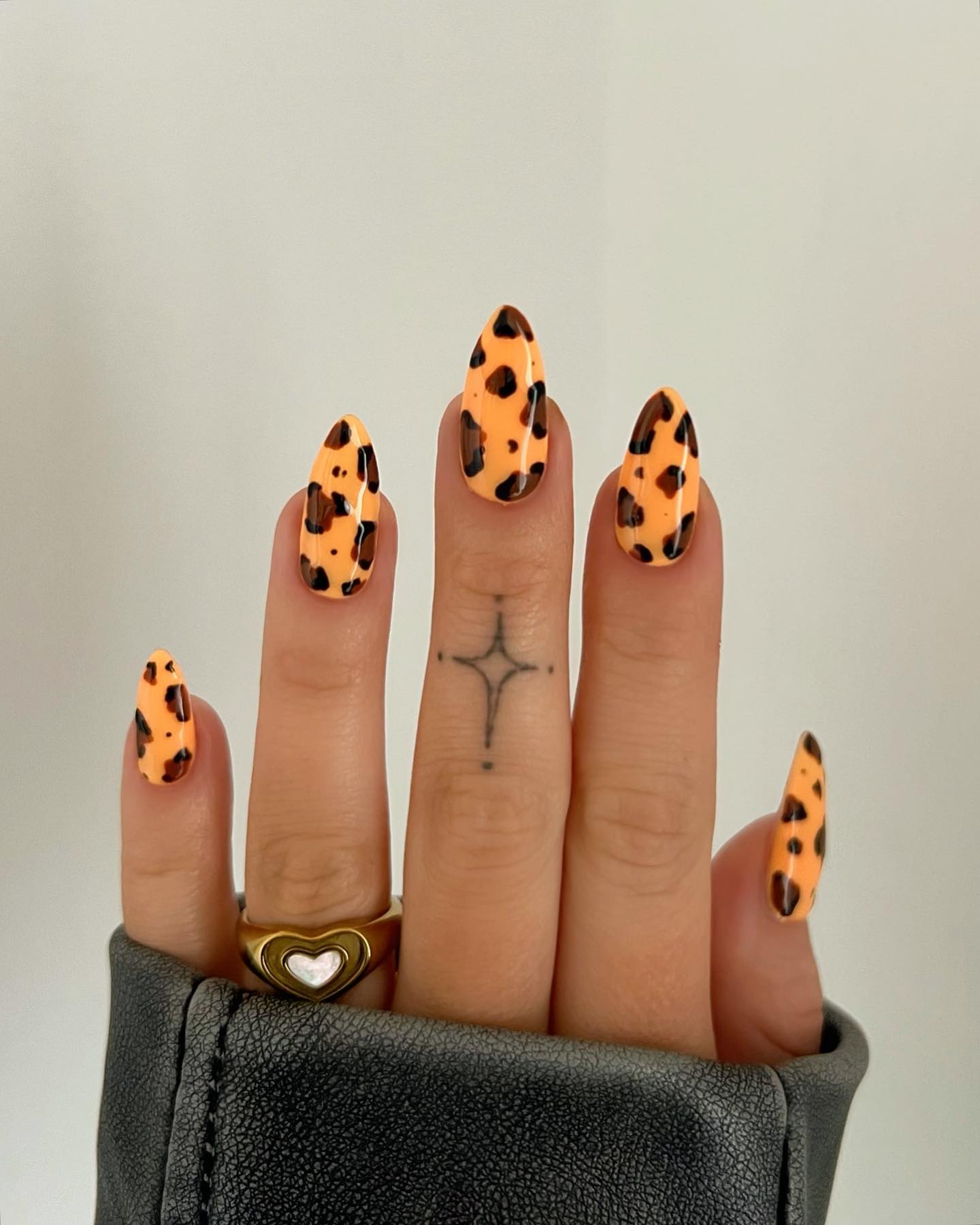 Vibrant Orange Cheetah Almond Nails