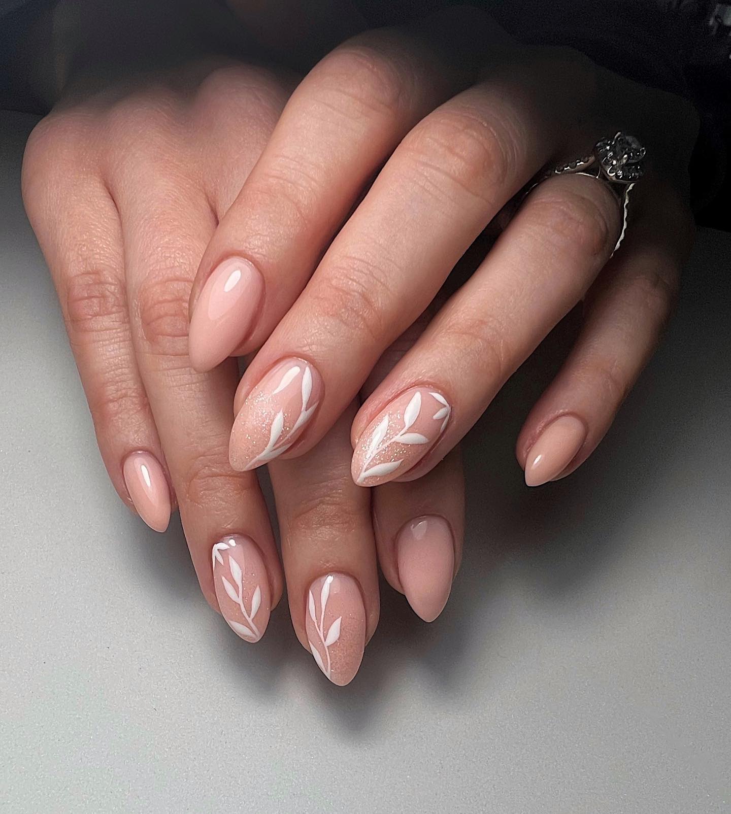 Ethereal Almond Nails With White Leaf Art