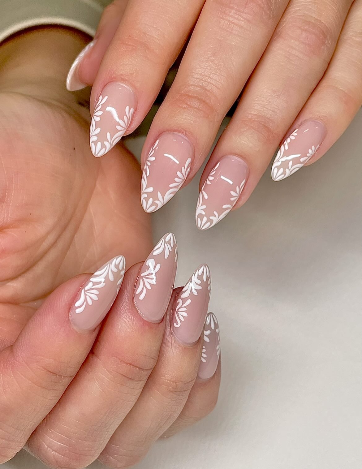 Neutral Floral Almond Nails with White Art