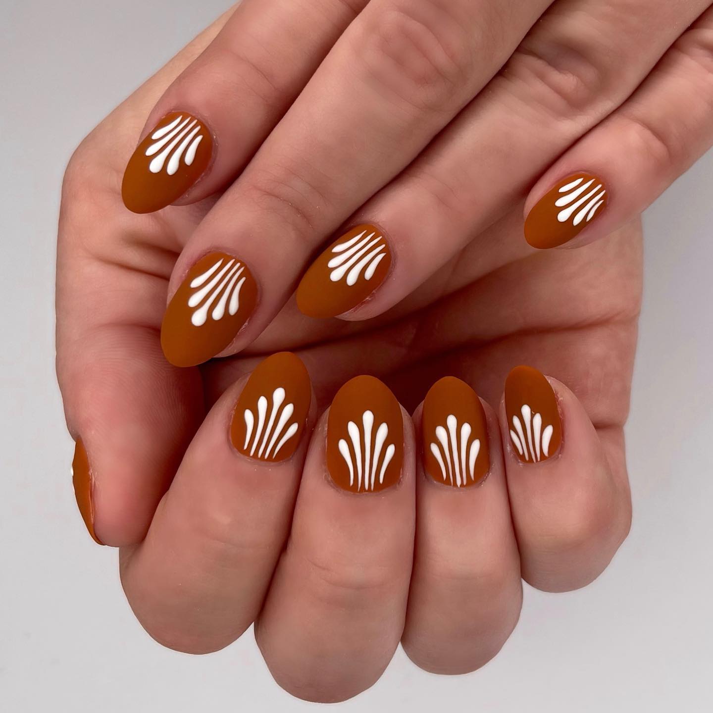 Matte Terracotta Fan Art Almond Nails