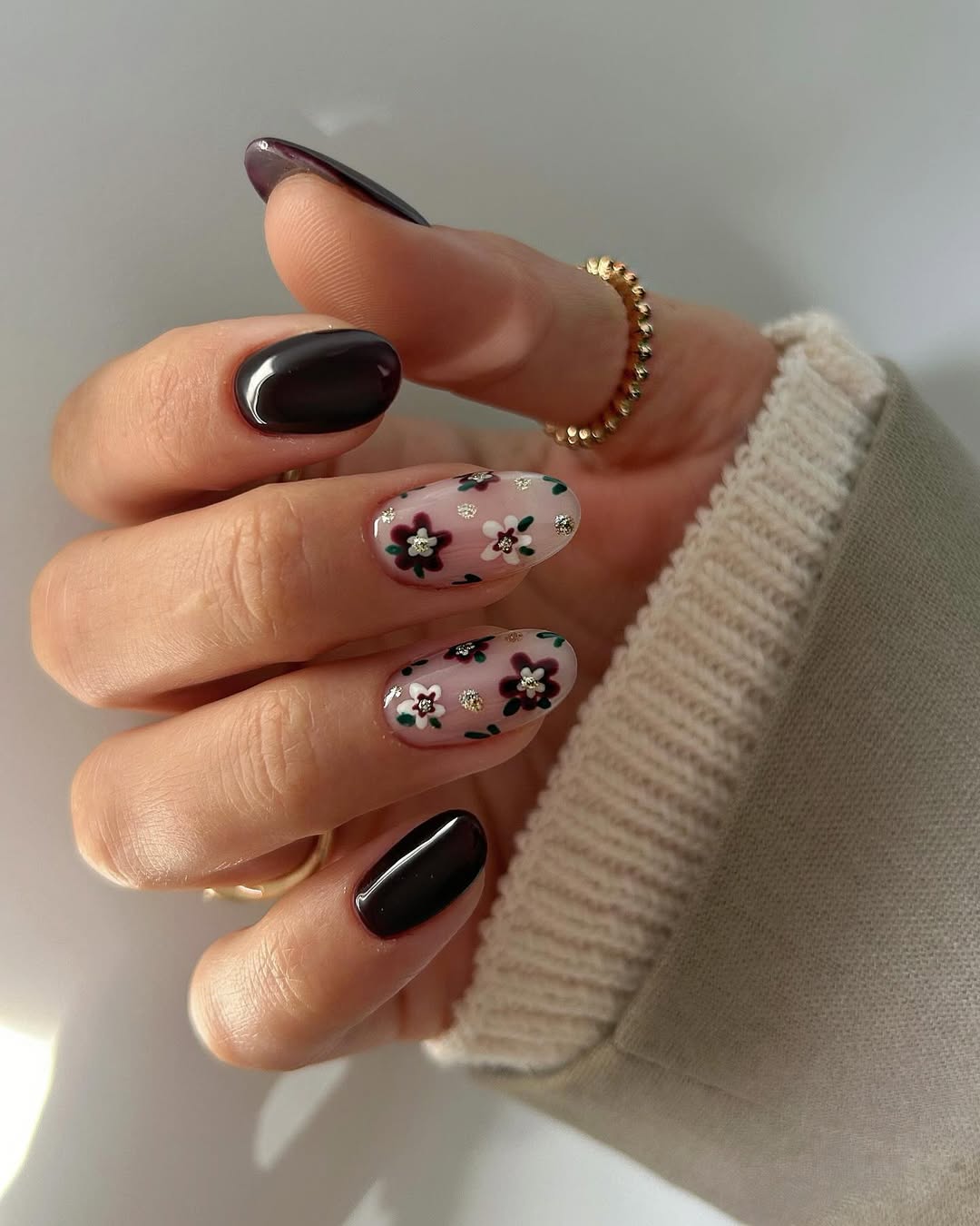 Dark Plum Oval Nails with Floral Accent
