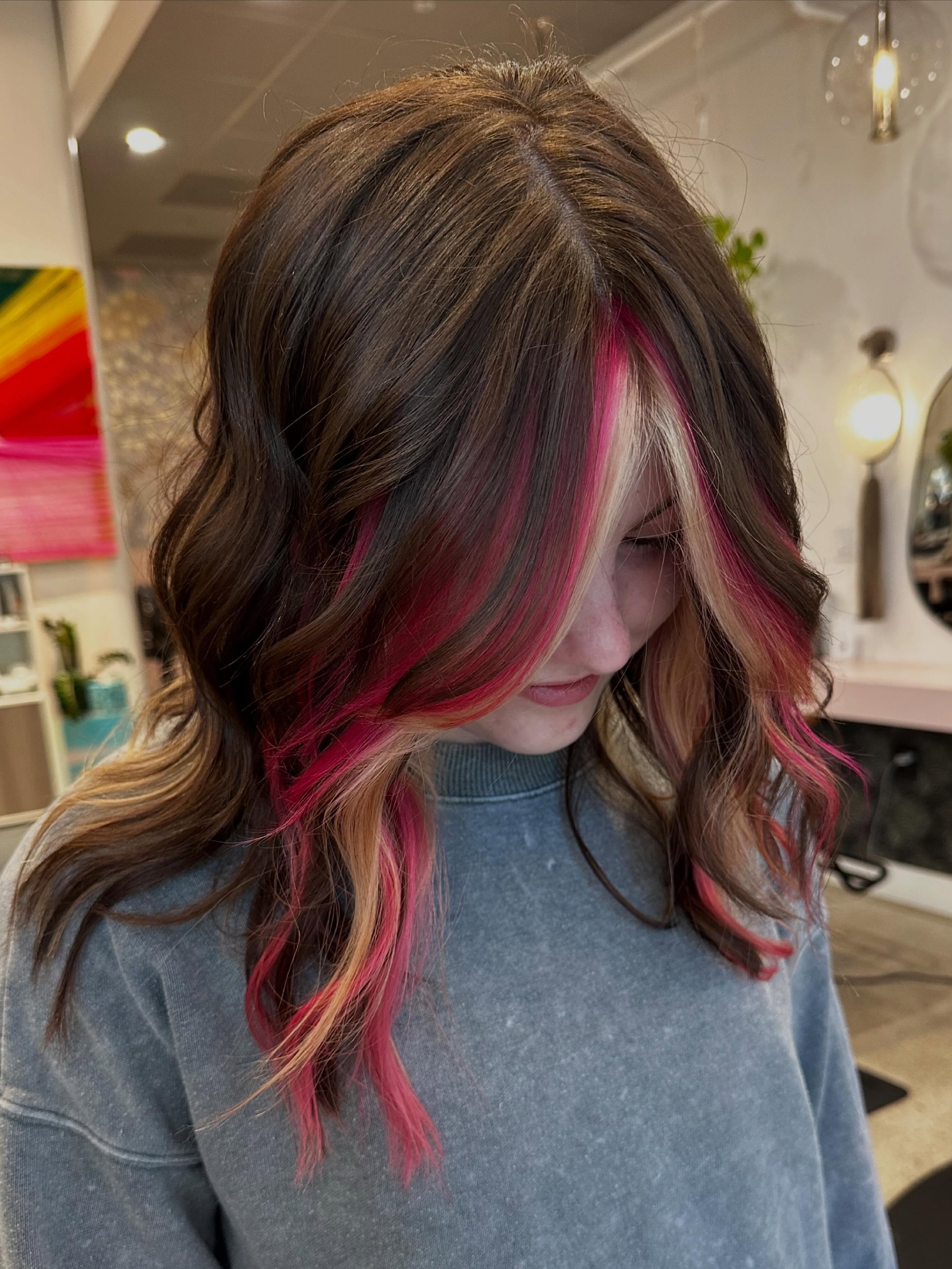Bold Pink Streaks On Dark Brown Wavy Hair