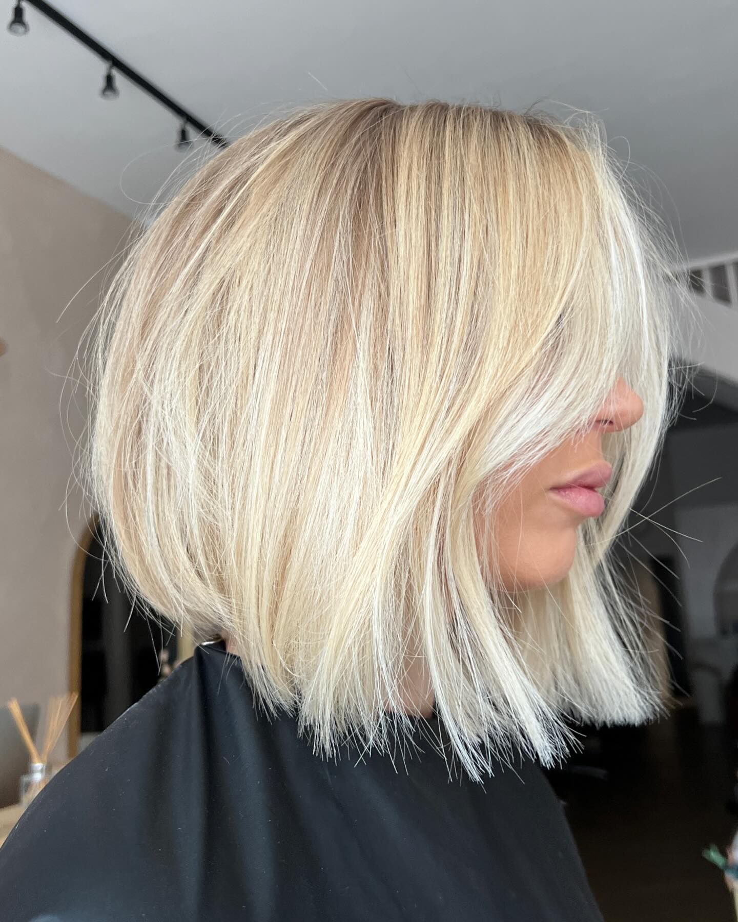 Tousled Platinum Blonde Bob With Face-Framing Strands