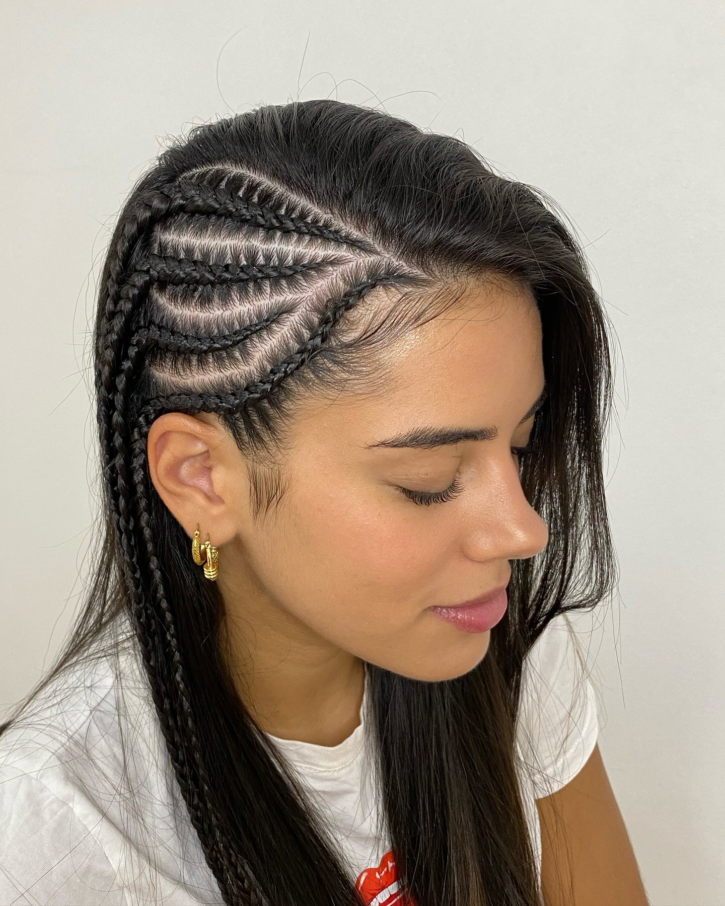 Asymmetrical Cornrow Braids With Loose Waves