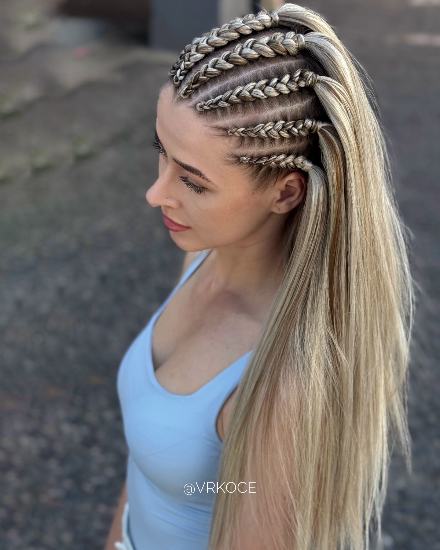 Platinum Blonde Cornrows With Long Flowing Strands