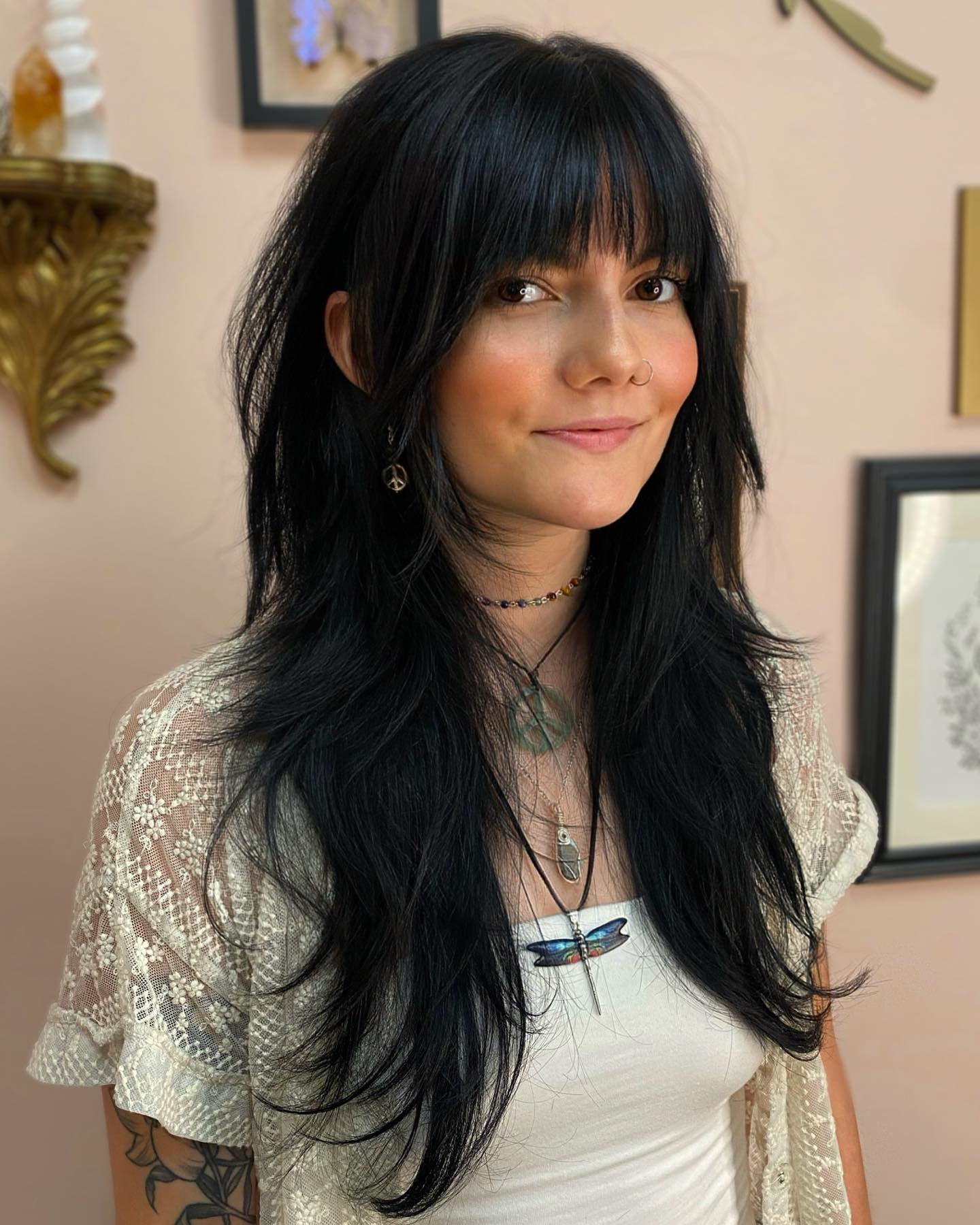 Shaggy Black Layers With Wispy Bangs