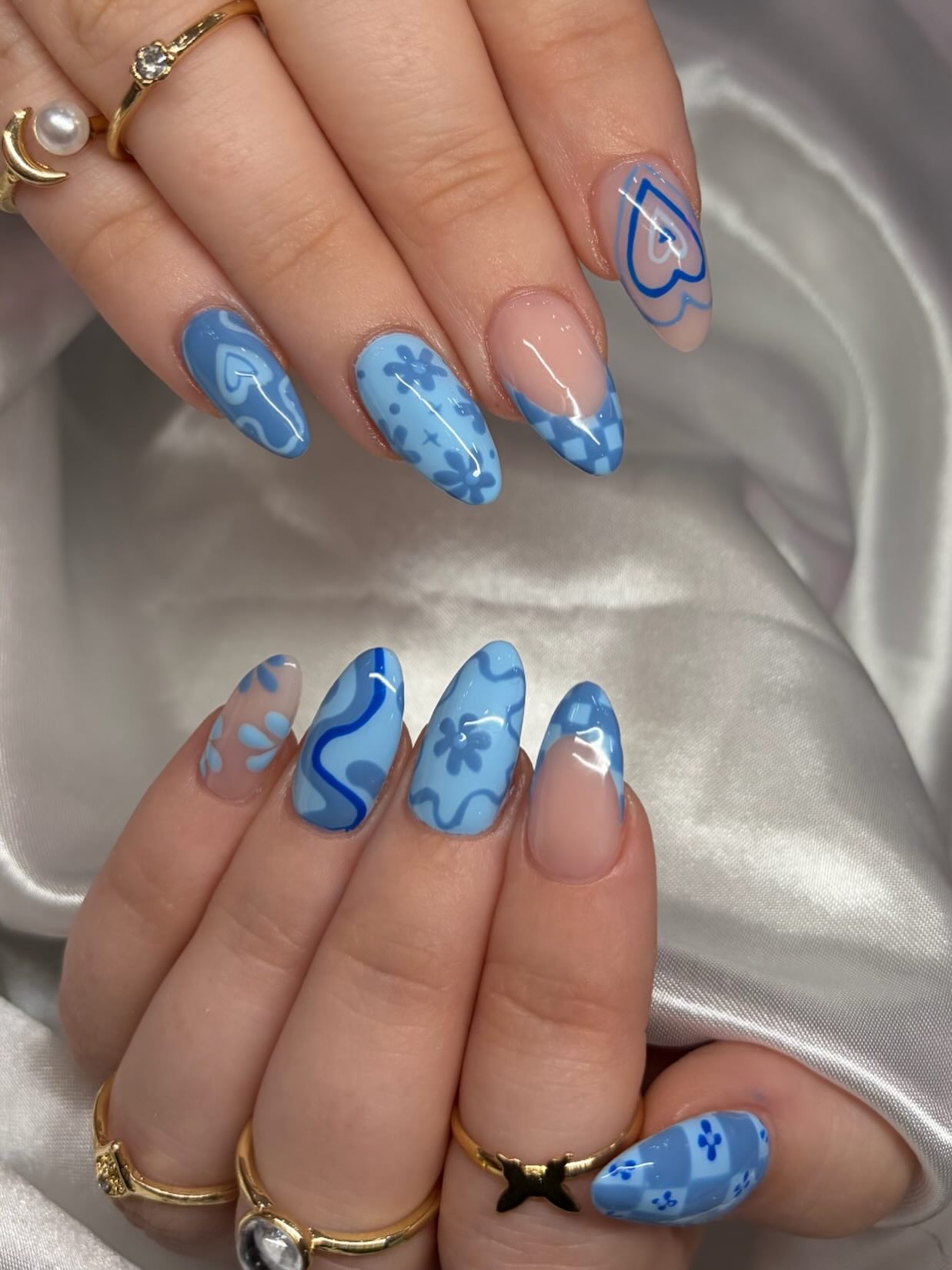 Glossy Blue Heart And Floral Almond Nails