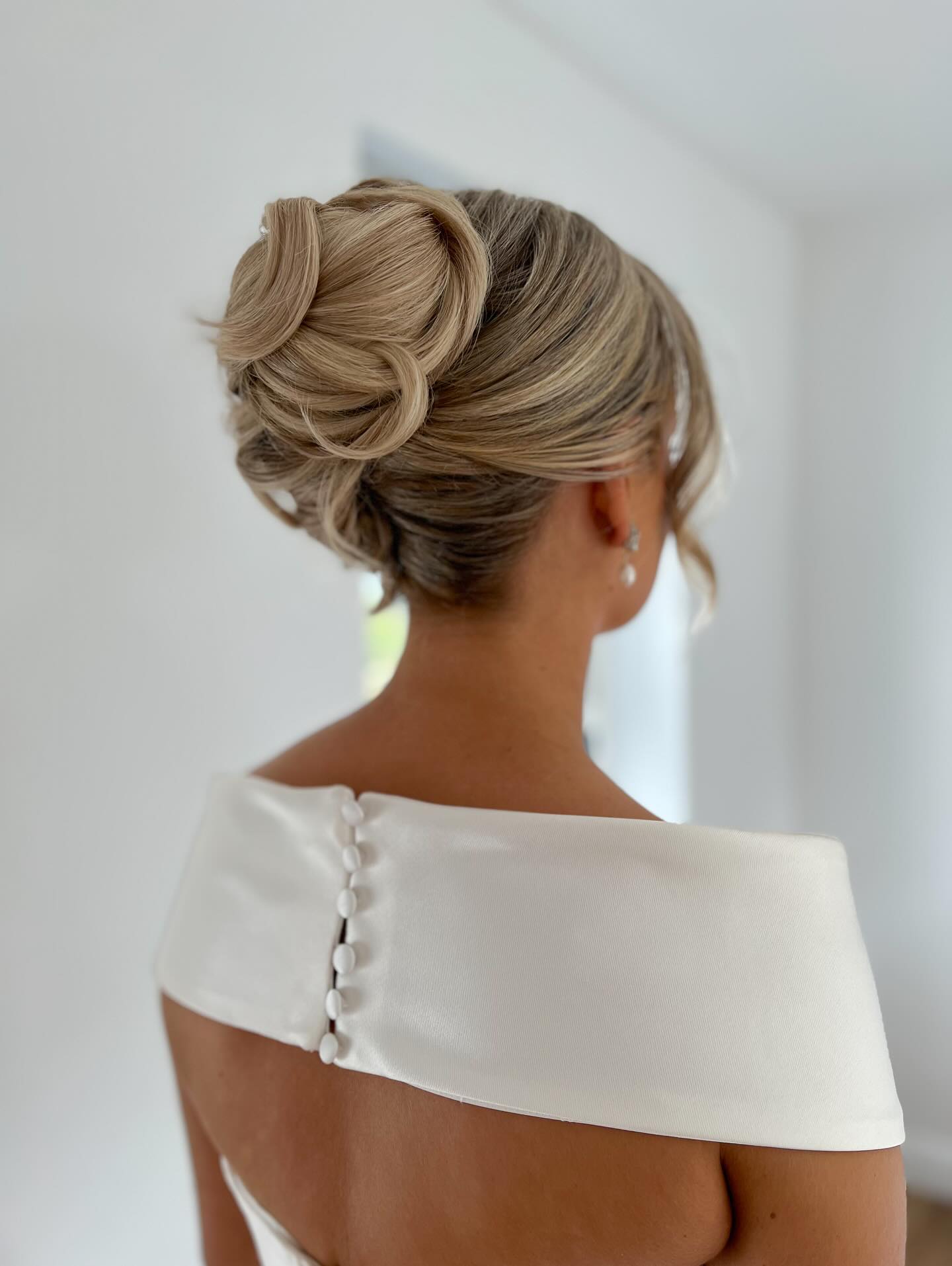 Textured Low Chignon With Soft Face Framing