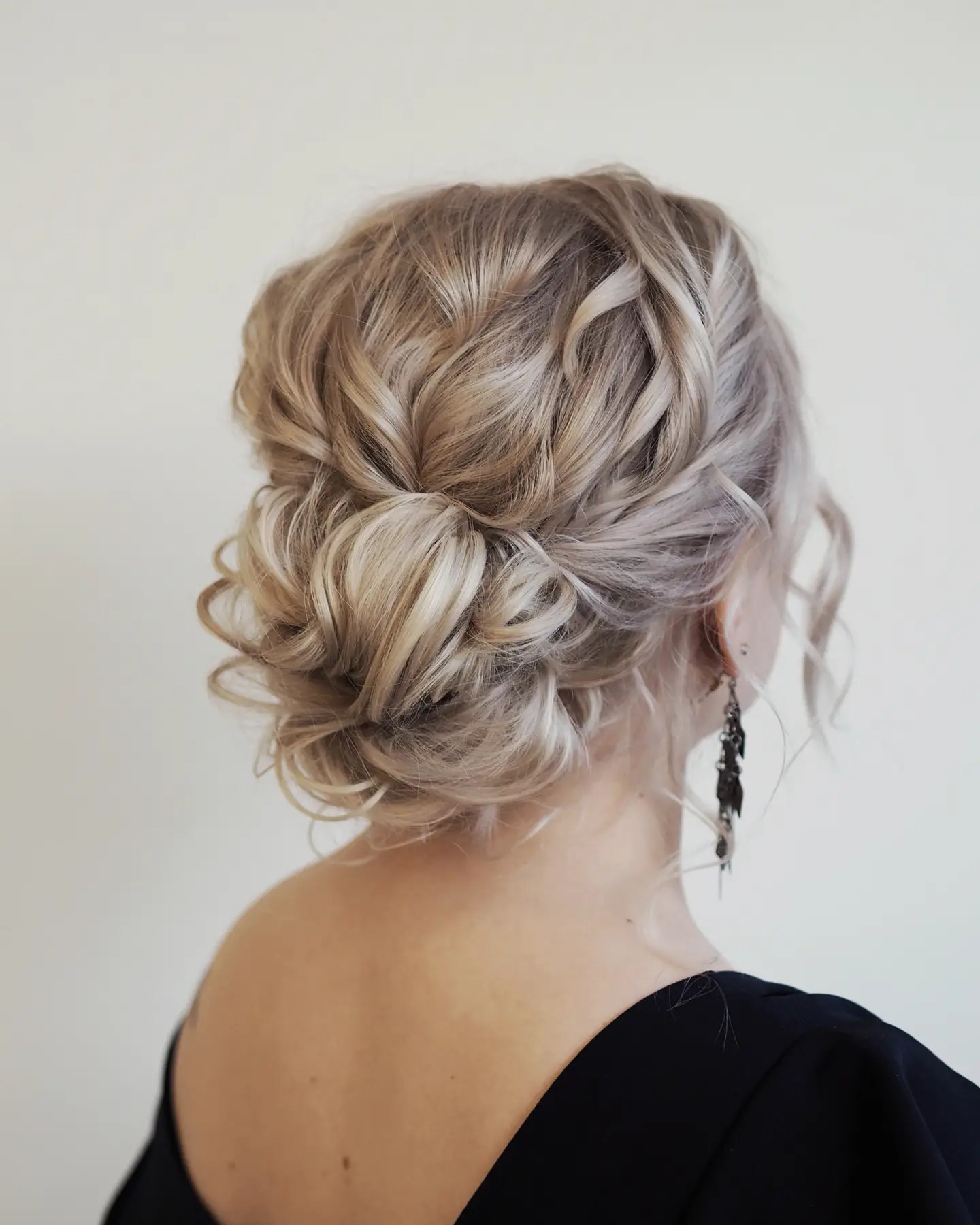 Romantic Textured Low Bun With Face Framing Tendrils