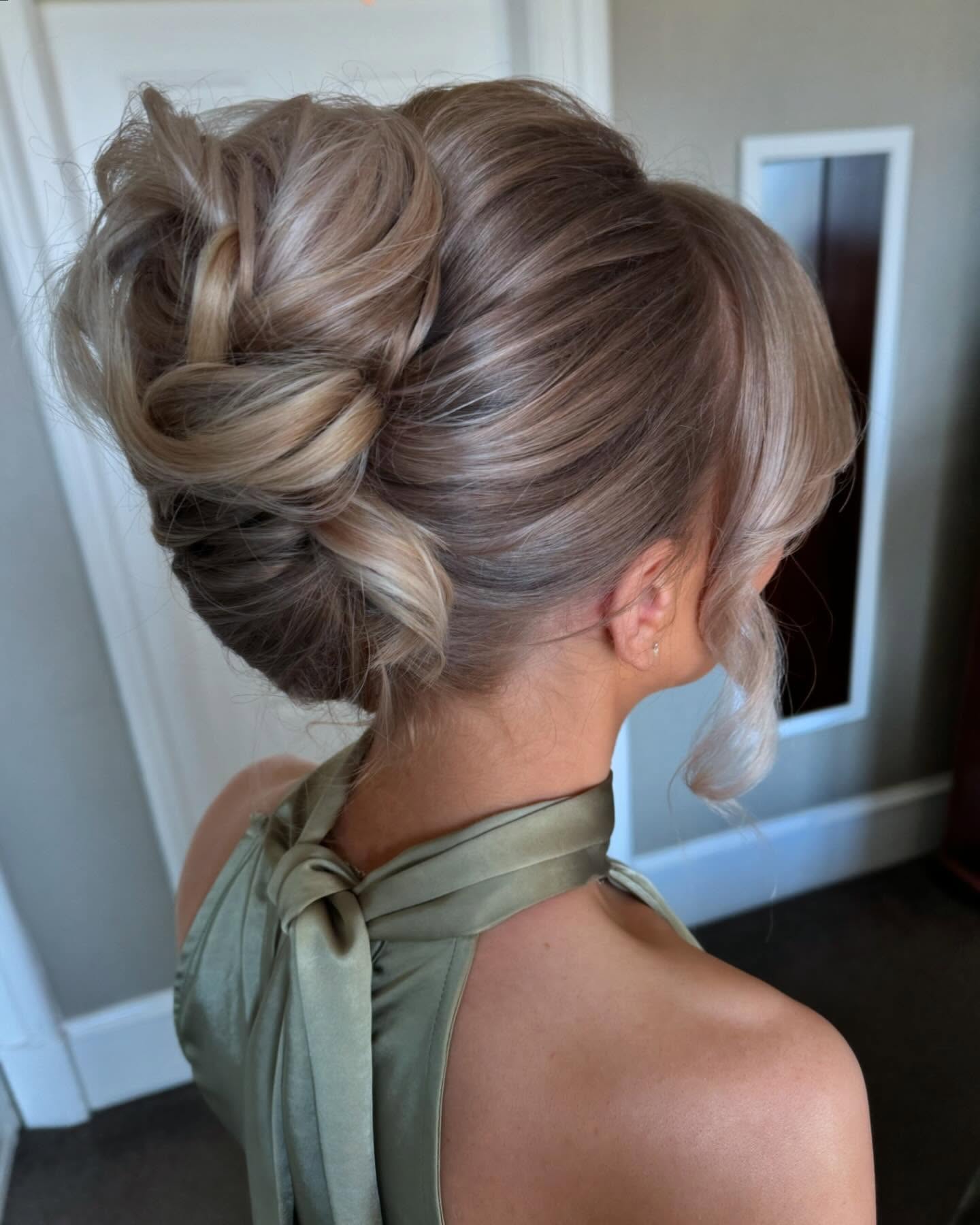 Voluminous Textured Updo With Soft Face Framing