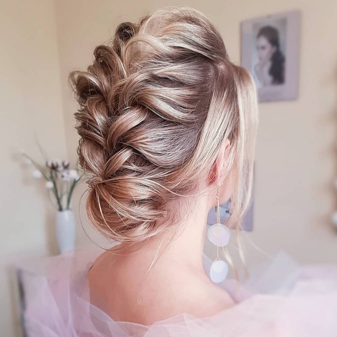 Voluminous Braided Updo With Soft Face Framing Layers