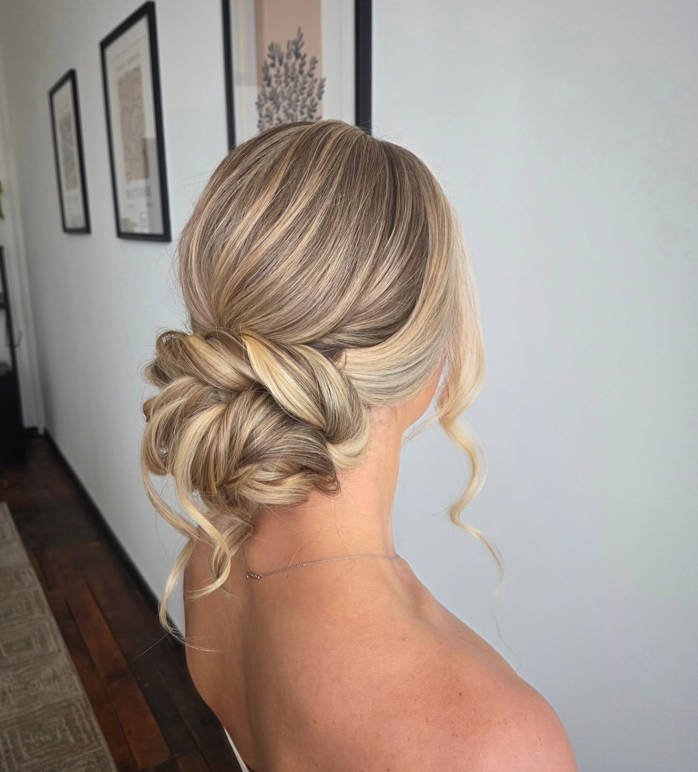 Textured Low Chignon With Face Framing Tendrils