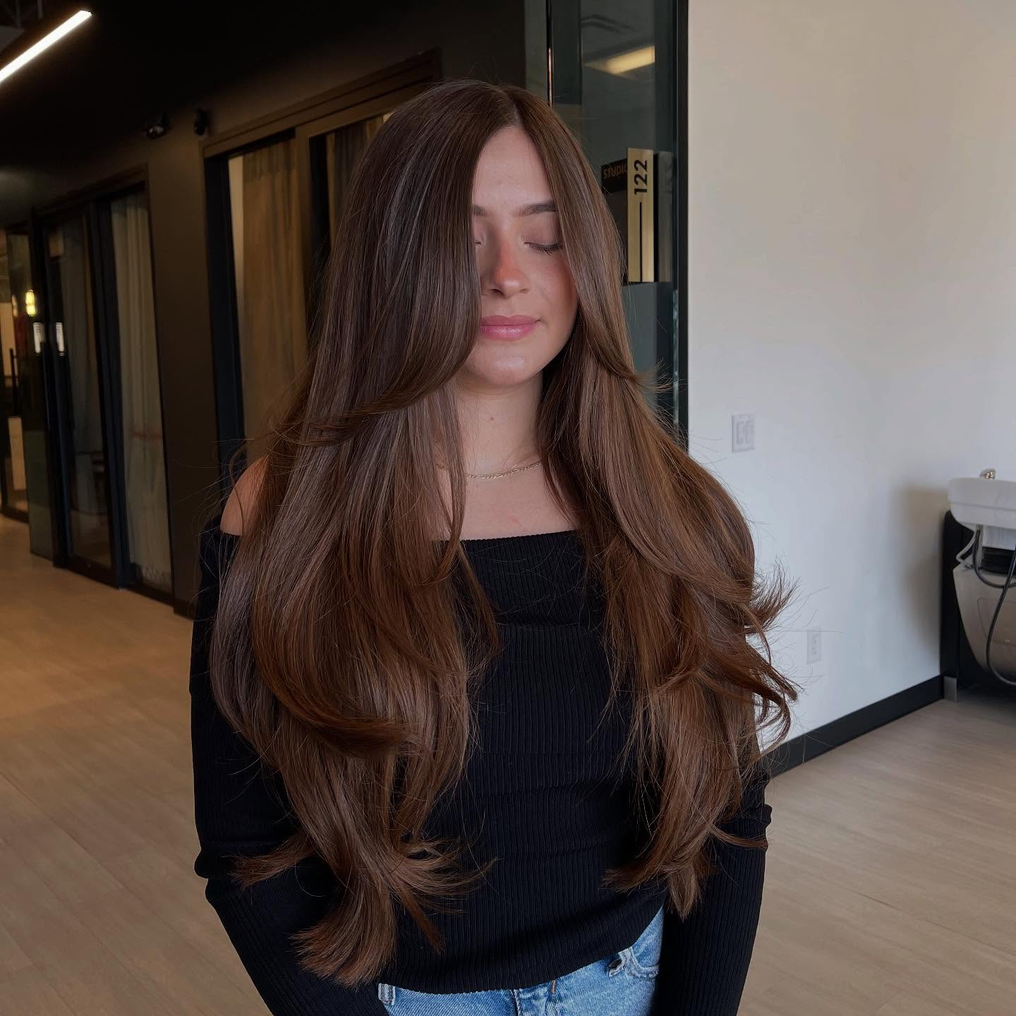 Long Layered Blowout With Face Framing Curtain Bangs