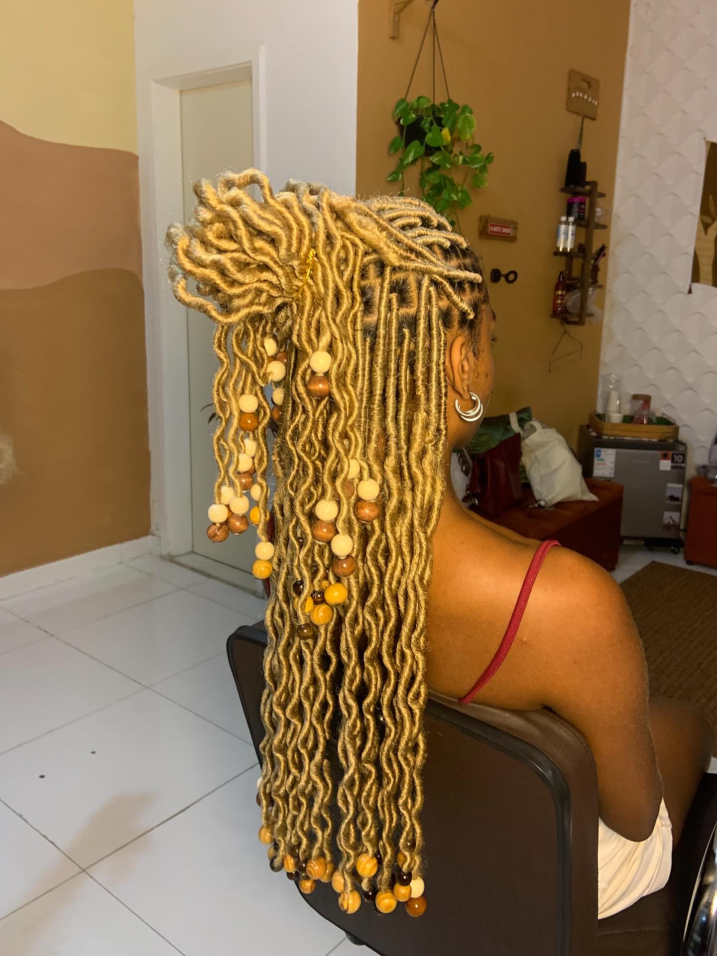 Honey Blonde Wavy Faux Locs With Wooden Beads