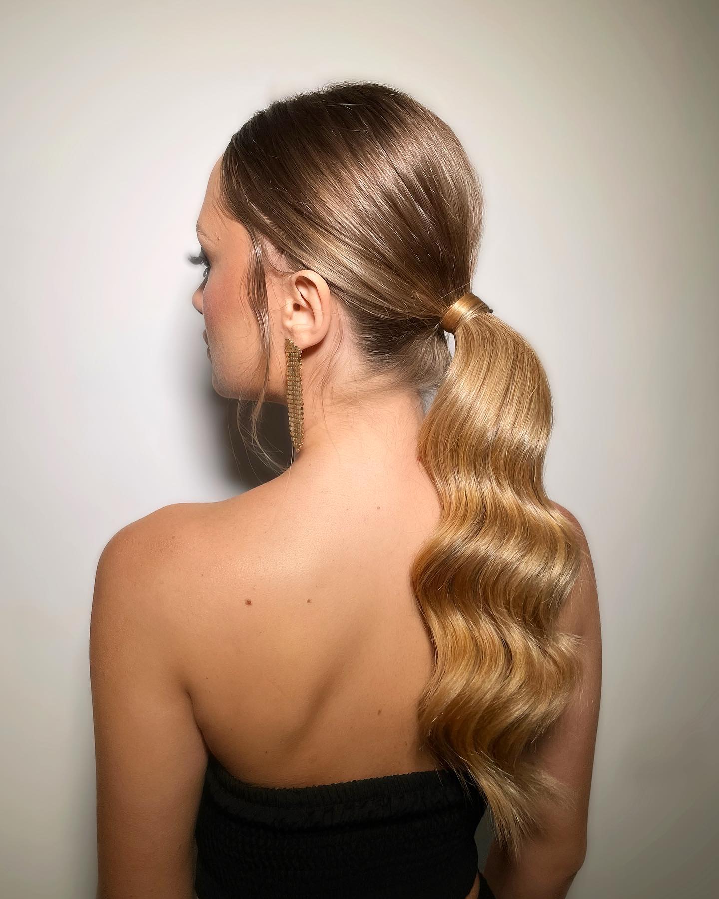 Sleek Low Ponytail With Defined Waves