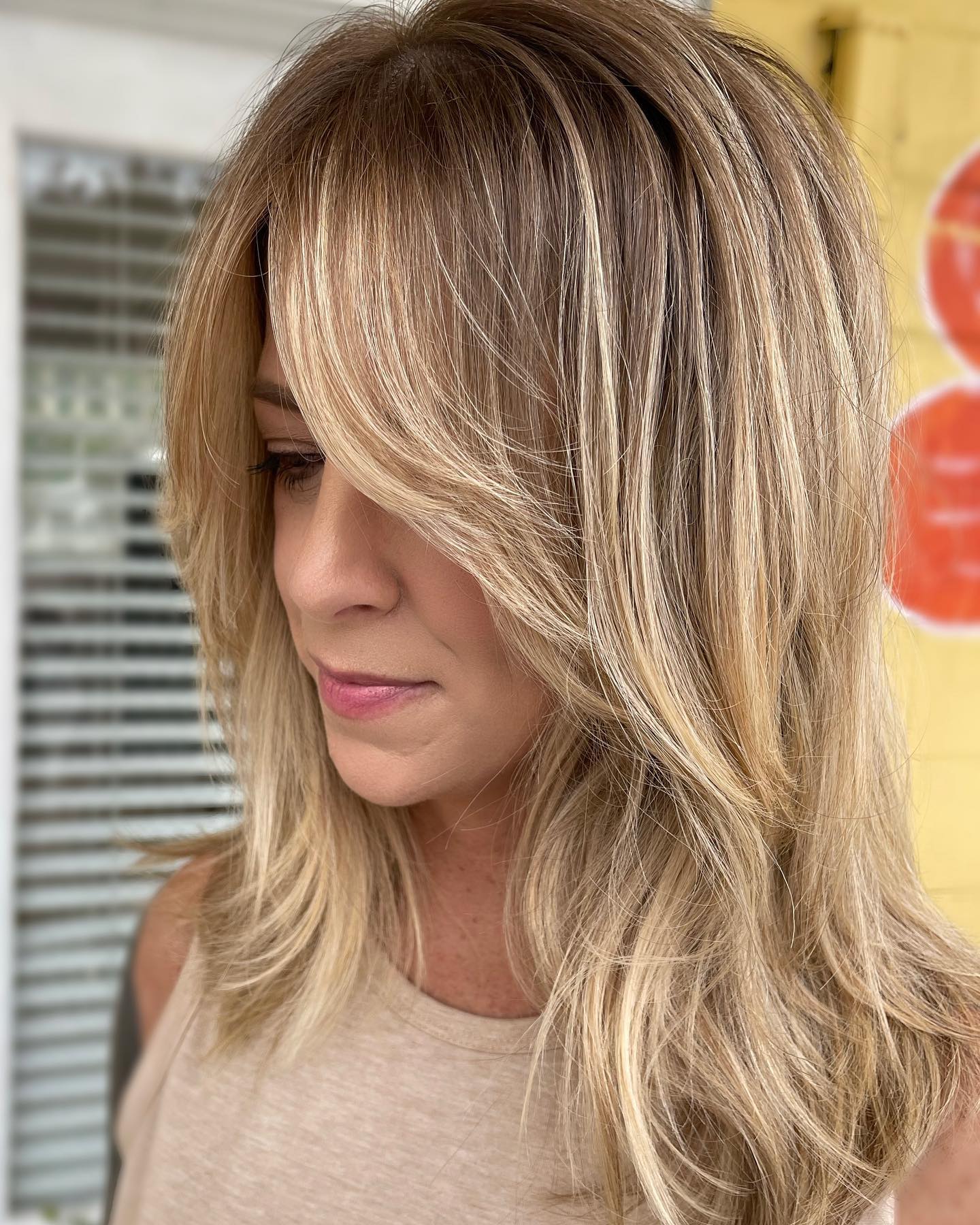 Layered Mid Length Cut With Face Framing Highlights